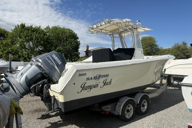 2006 Sailfish 2660 CC boat on trailer with Yamaha engine, parked outdoors.