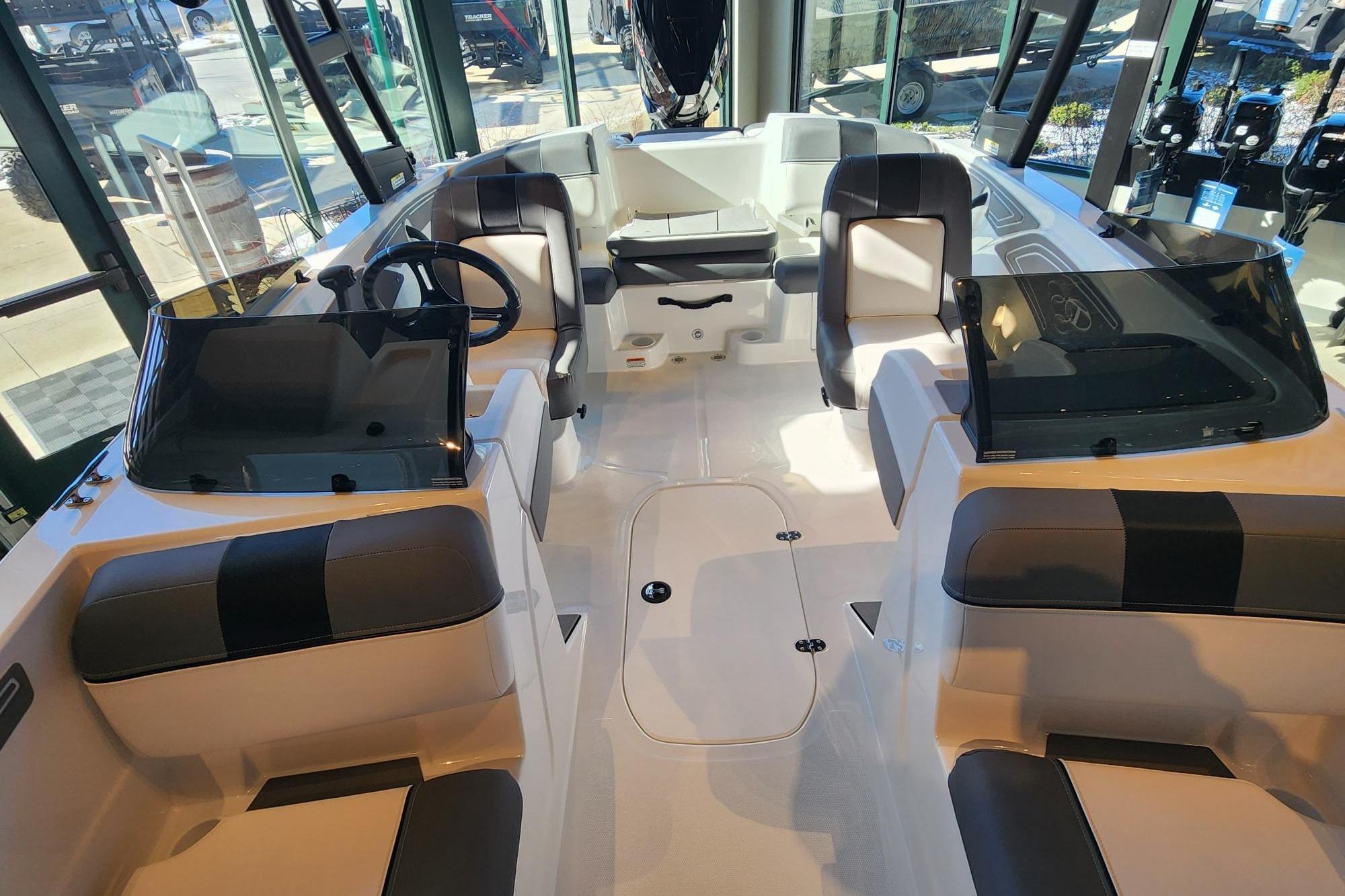 2026 Tahoe T21 boat interior with modern seating and steering wheel.
