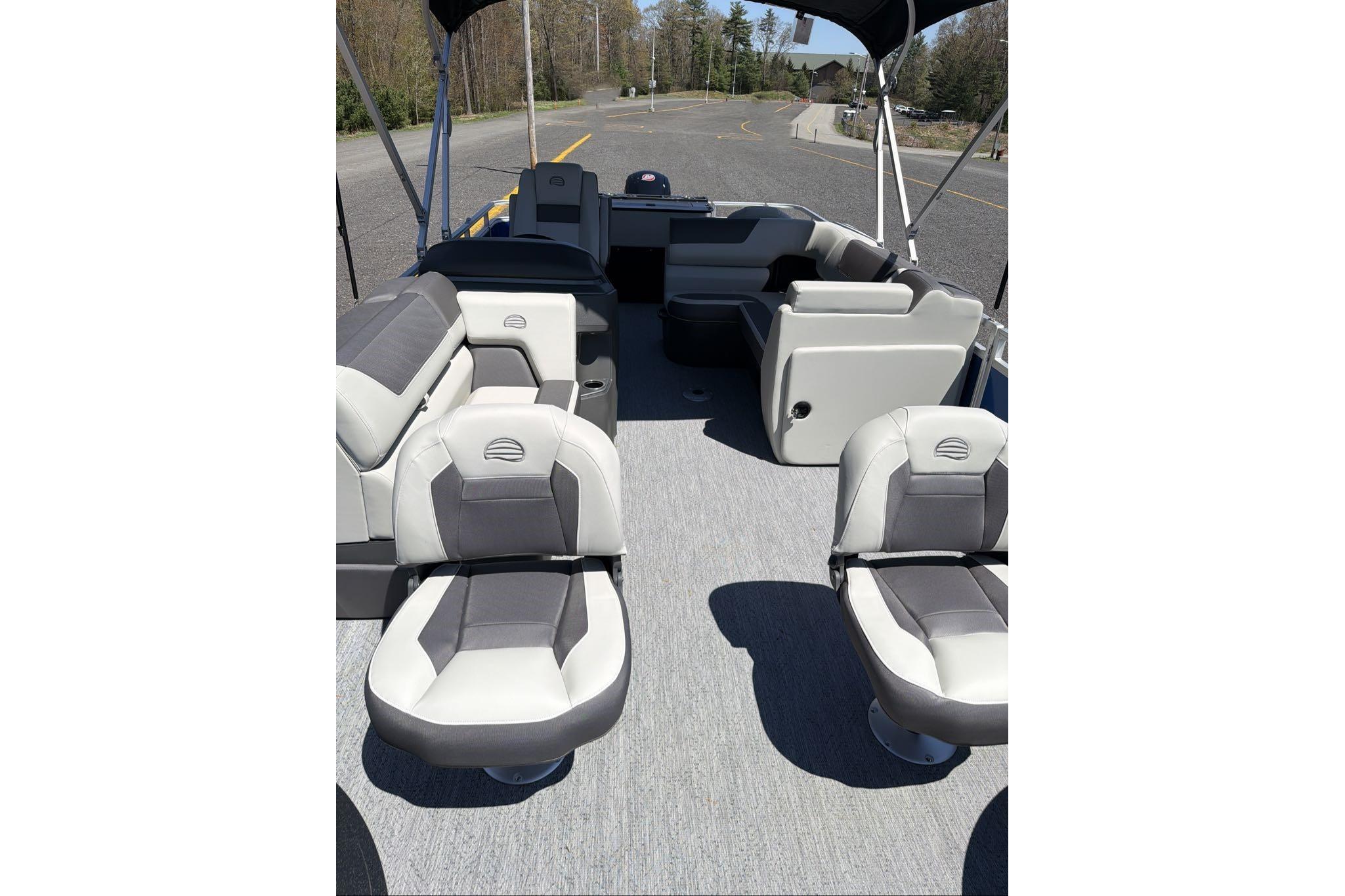 2026 Sun Tracker Fishin' Barge 20 DLX interior with comfortable seating and spacious layout.