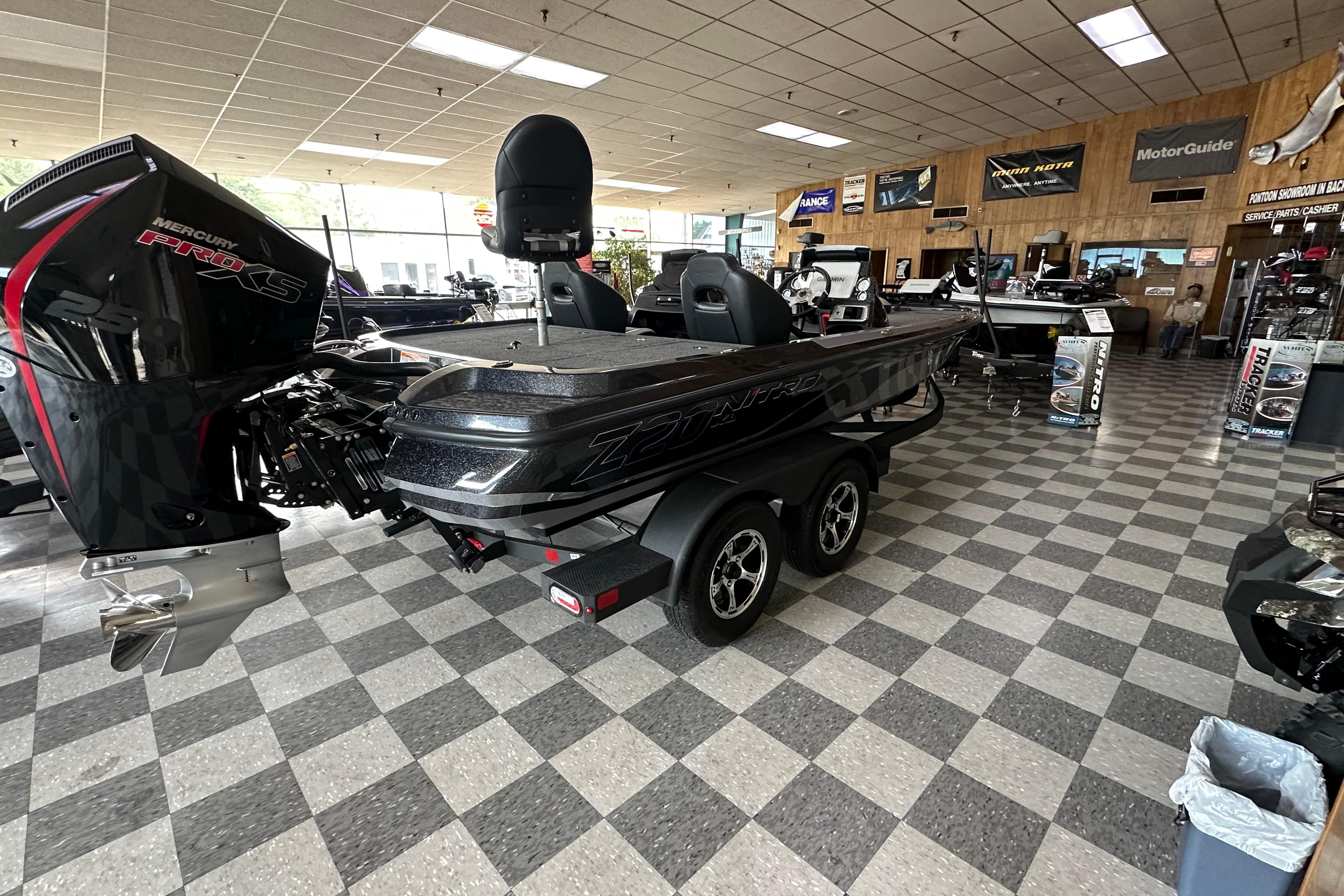 2025 Nitro Z20 XL Pro boat displayed in showroom with Mercury Pro XS engine.