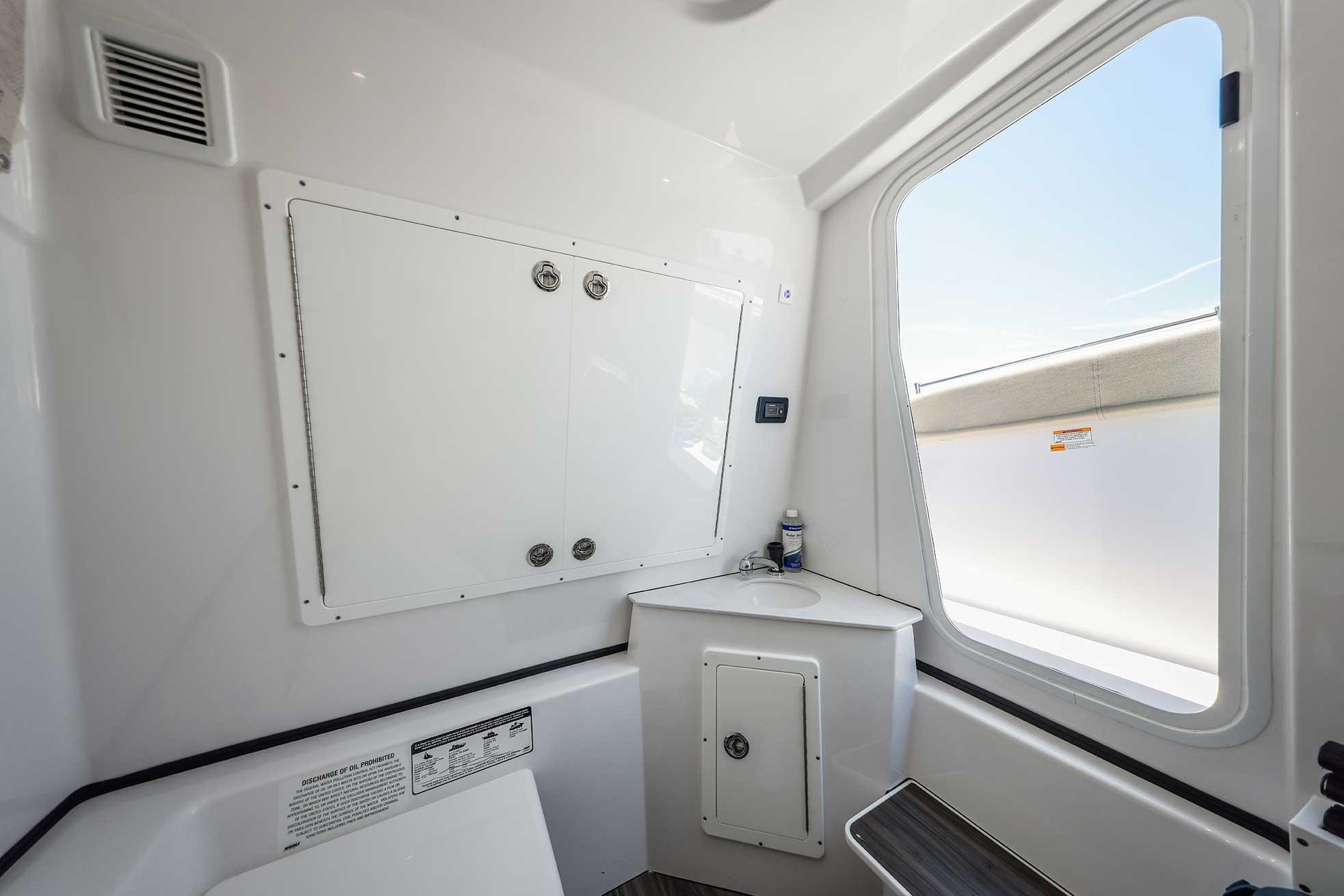 2024 Sportsman Open 352 Center Console interior with storage and window view.