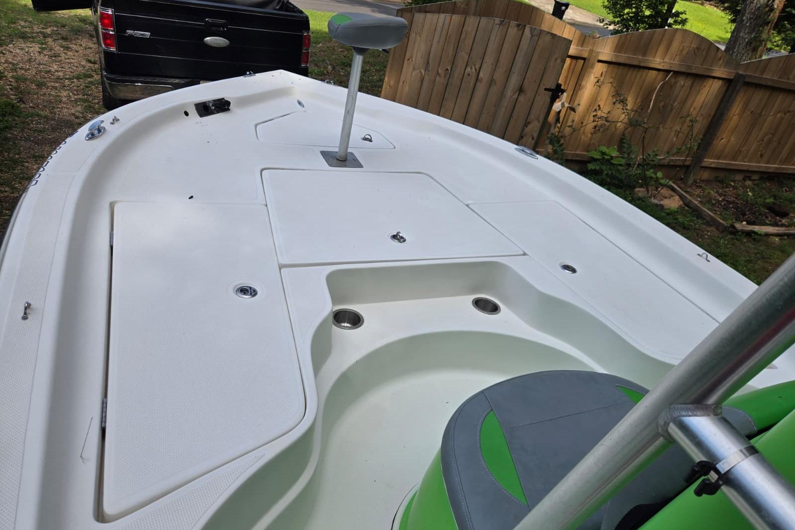 2016 Epic 21 Sport Console boat interior with seating and storage compartments.