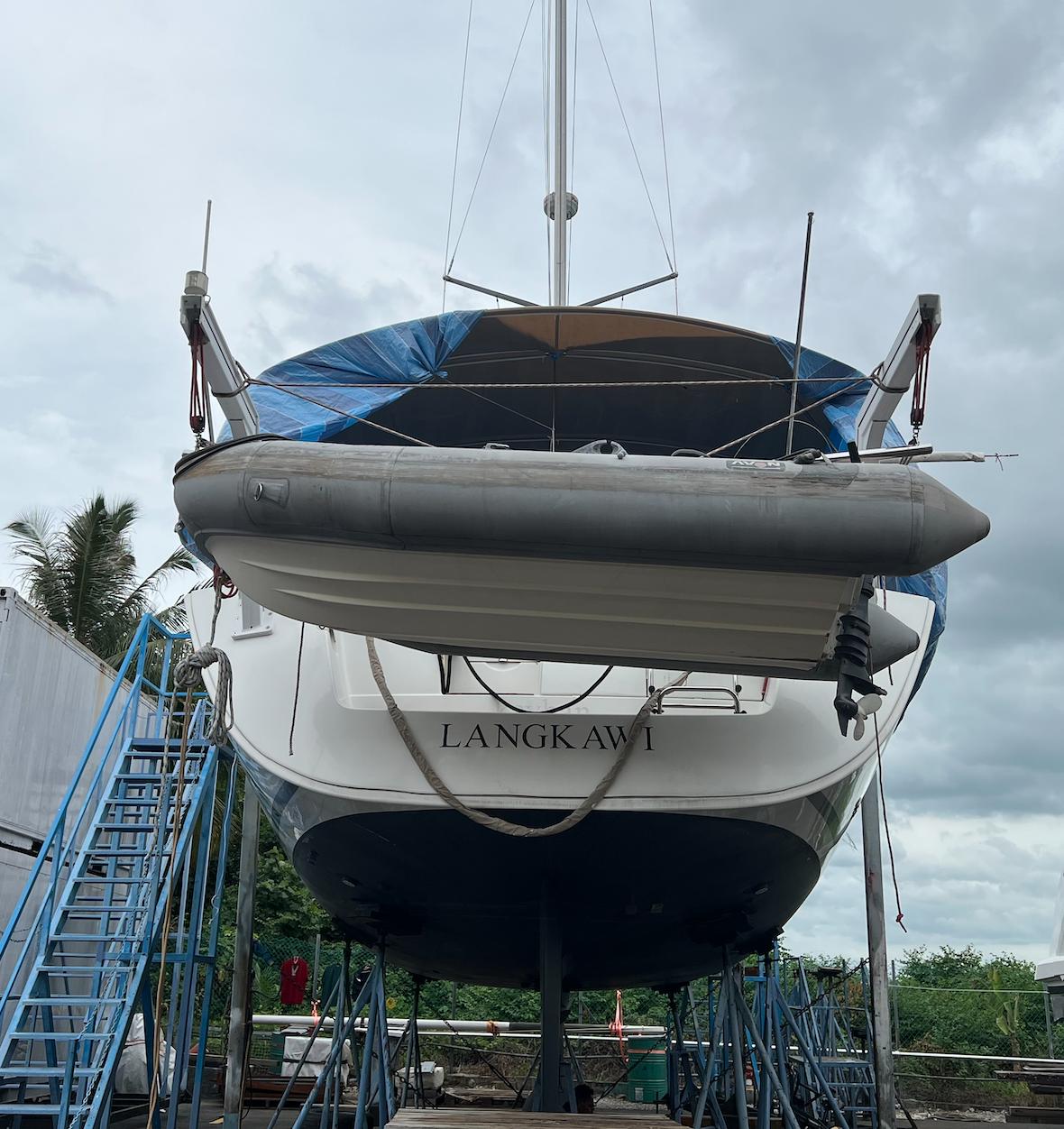 2010 Beneteau Oceanis 54 sailboat in dry dock, Langkawi, with inflatable dinghy.