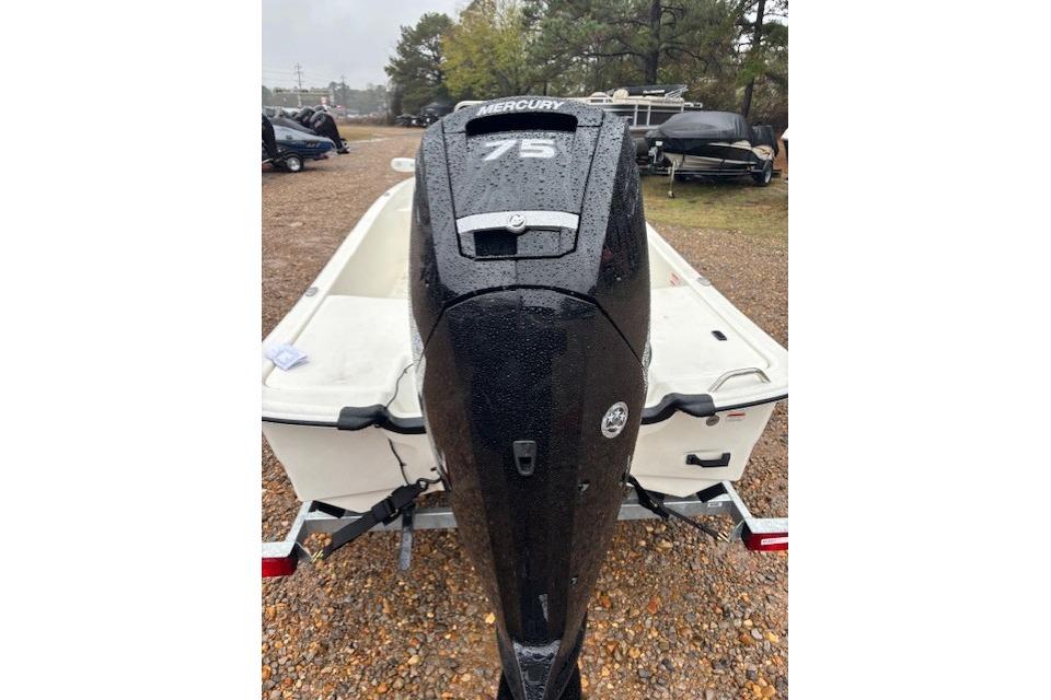 2026 Mako Pro Skiff 17 CC with Mercury 75 outboard engine in a parking lot.