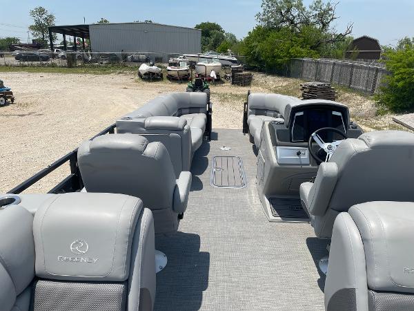 2023 Regency 250 LE3 pontoon boat with spacious seating and modern design.