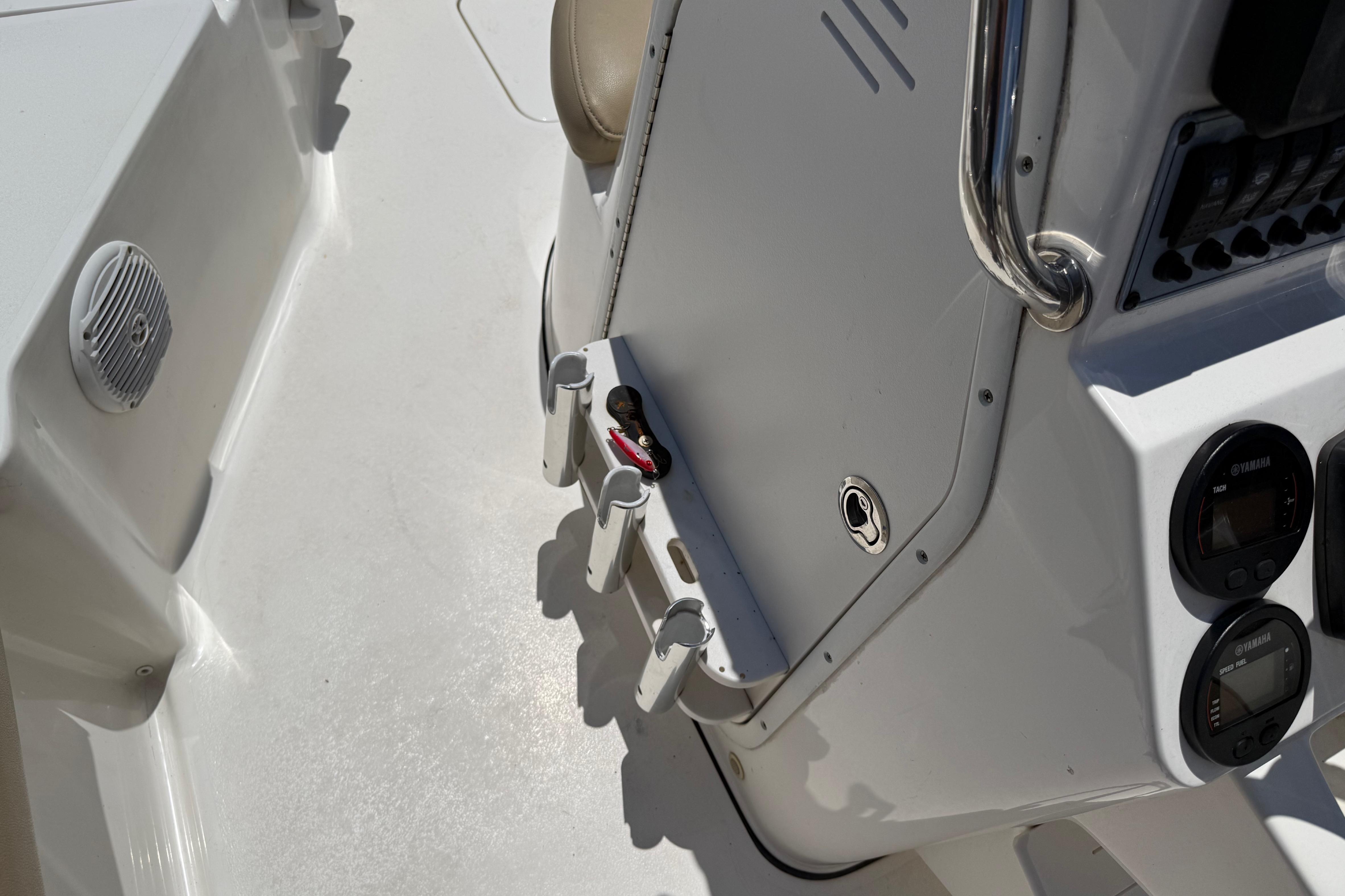 2019 Key West 230 Bay Reef boat console with gauges and rod holders.