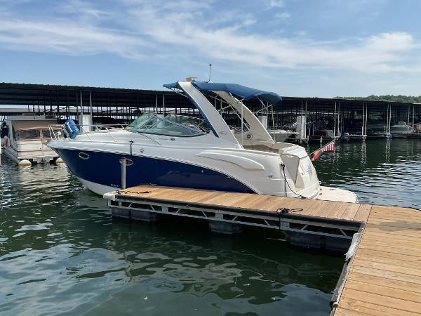 2008 Chaparral Signature 310 boat docked on a sunny day.