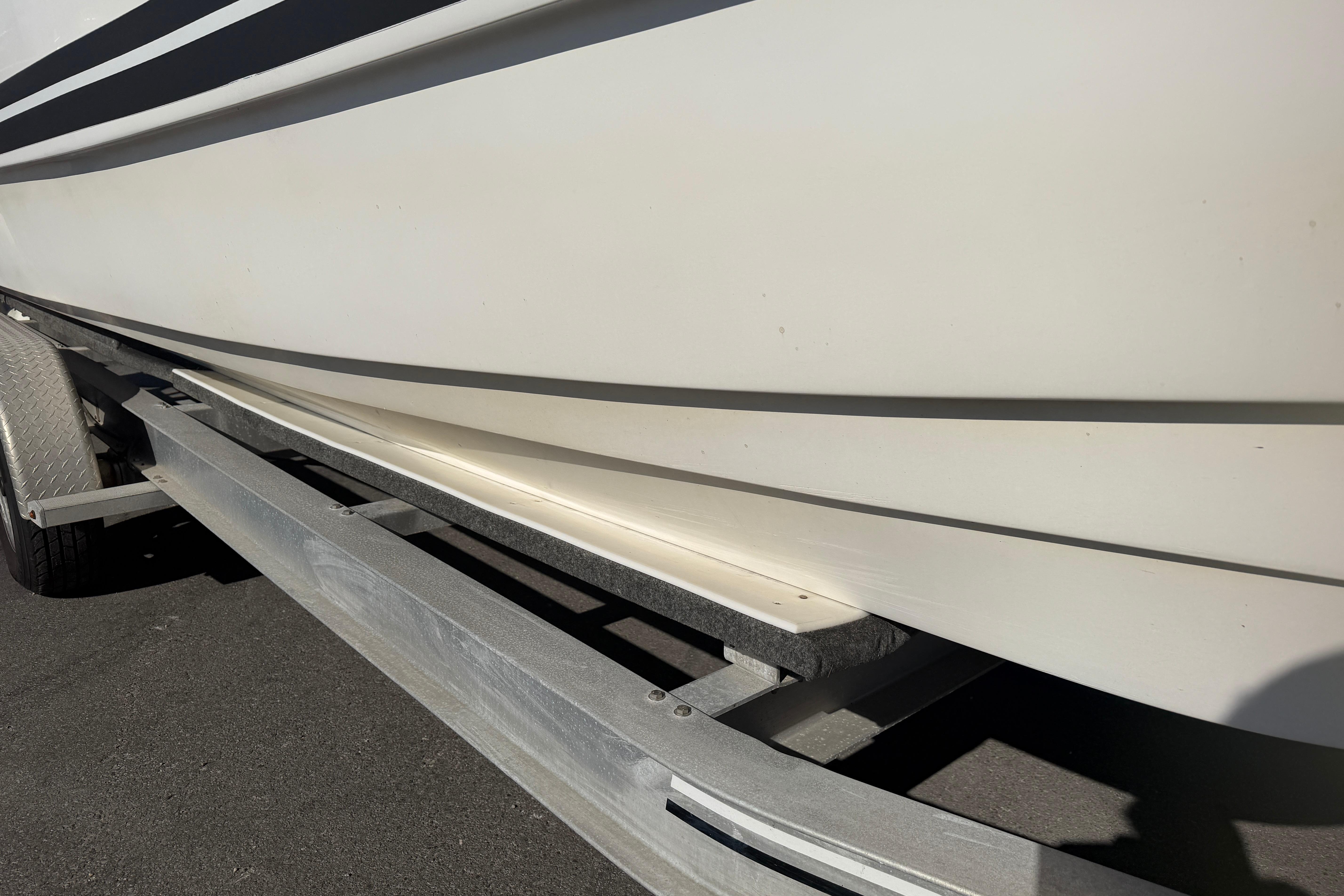 2018 Twin Vee 260 CC SE boat on trailer, side view.