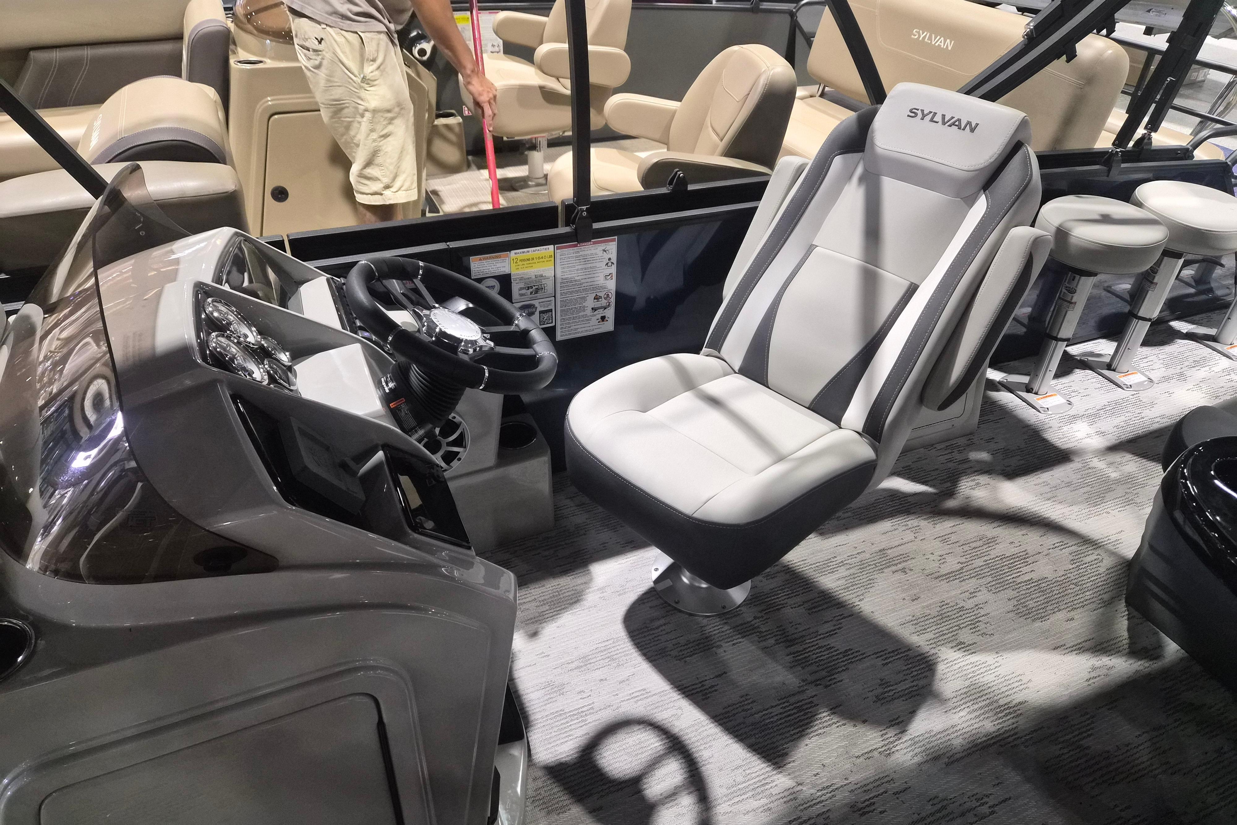 2026 Sylvan R-22 LZ DH boat interior with modern seating and steering console.