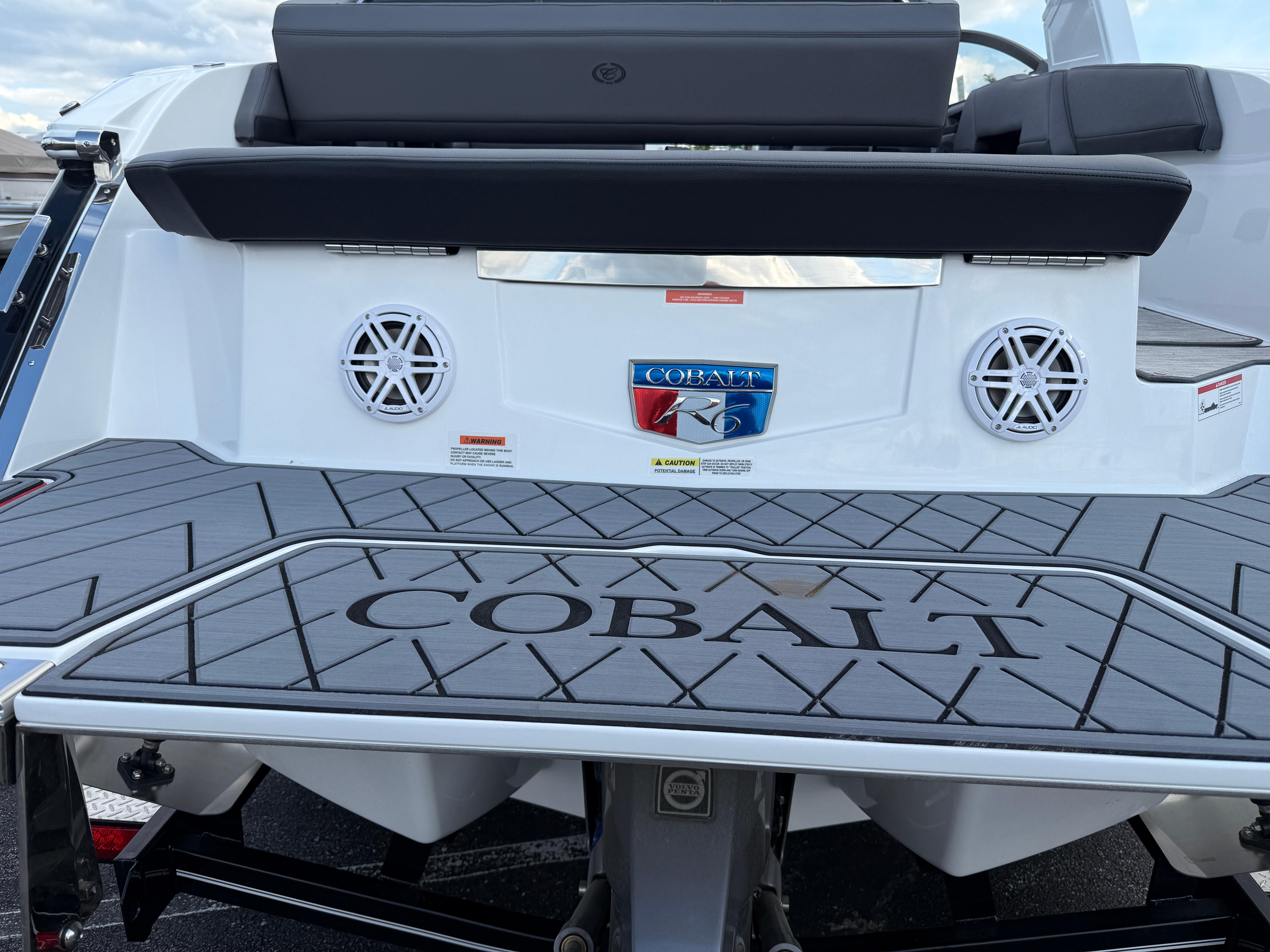 2025 Cobalt R6 boat rear view with speakers and logo on deck.
