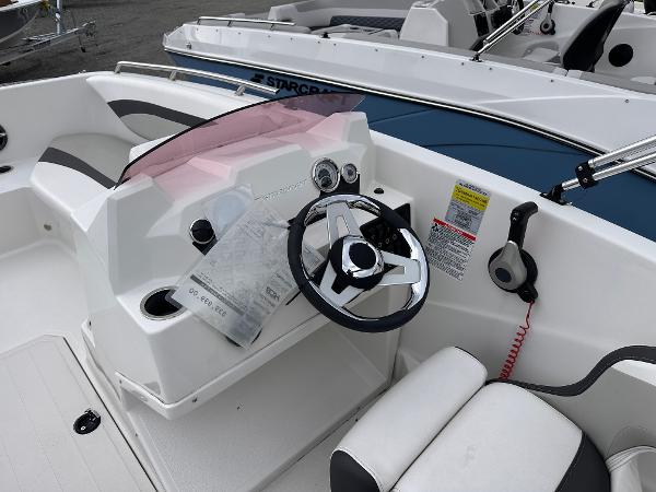 2024 Starcraft 171 SVX boat cockpit with steering wheel and controls.