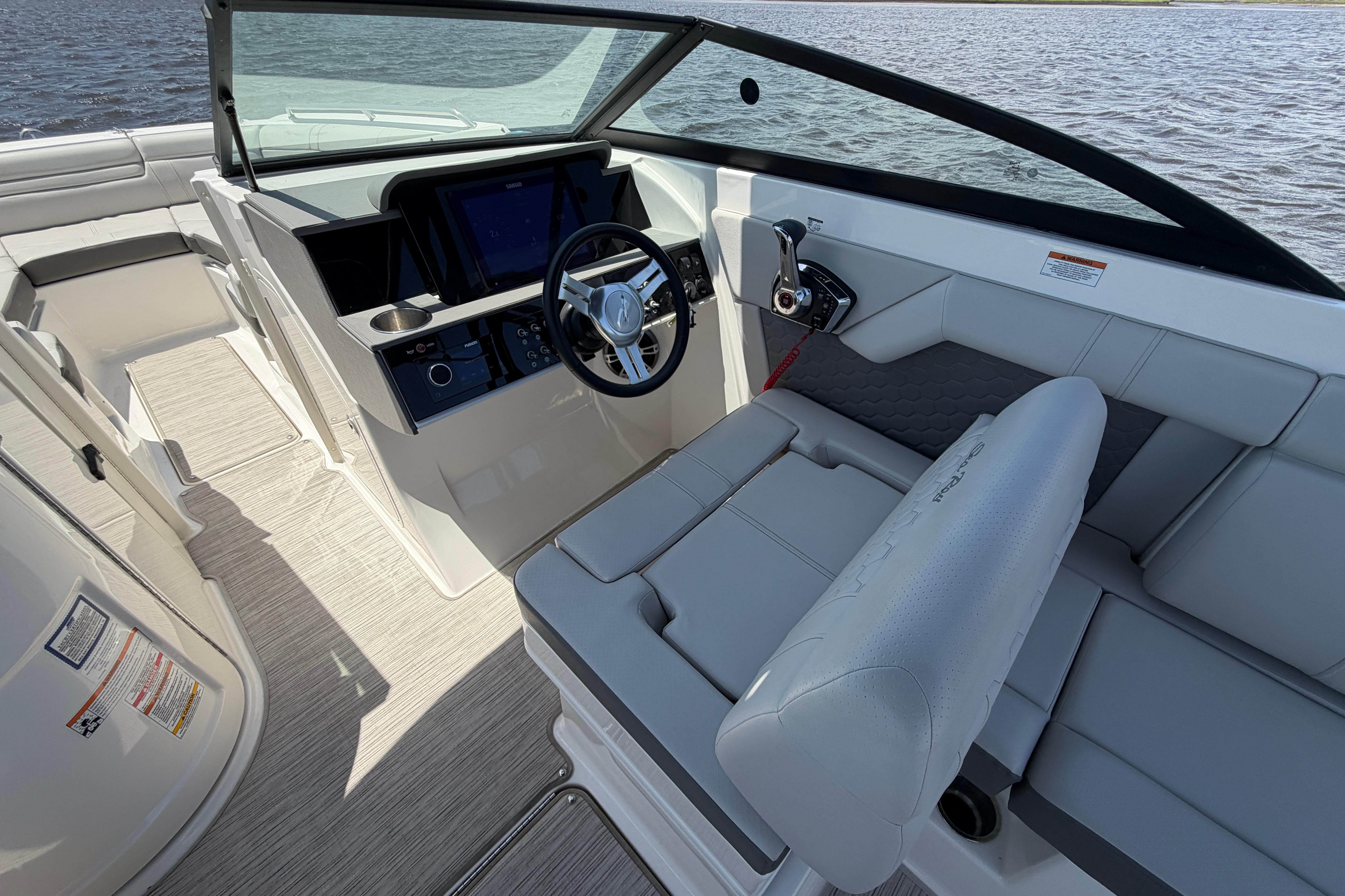 2024 Sea Ray SDX 270 Outboard boat interior with modern helm and seating.