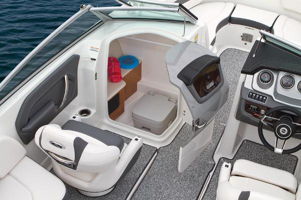 Manufacturer Provided Image: 2016 Chaparral 244 Sunesta boat interior with helm, seating, and storage compartment.