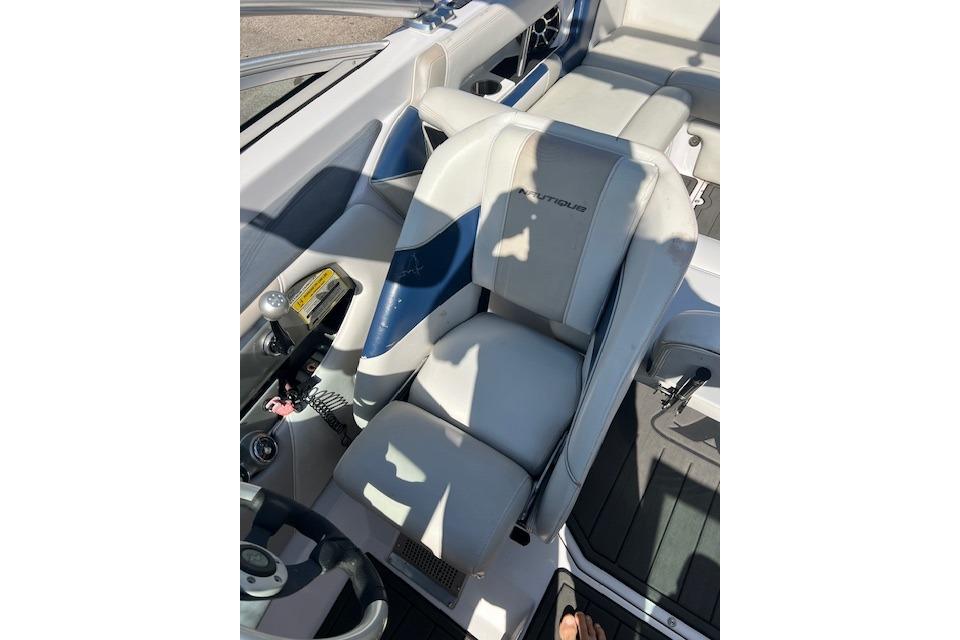 2008 Nautique Super Air Nautique 230 boat interior with white and blue seating.
