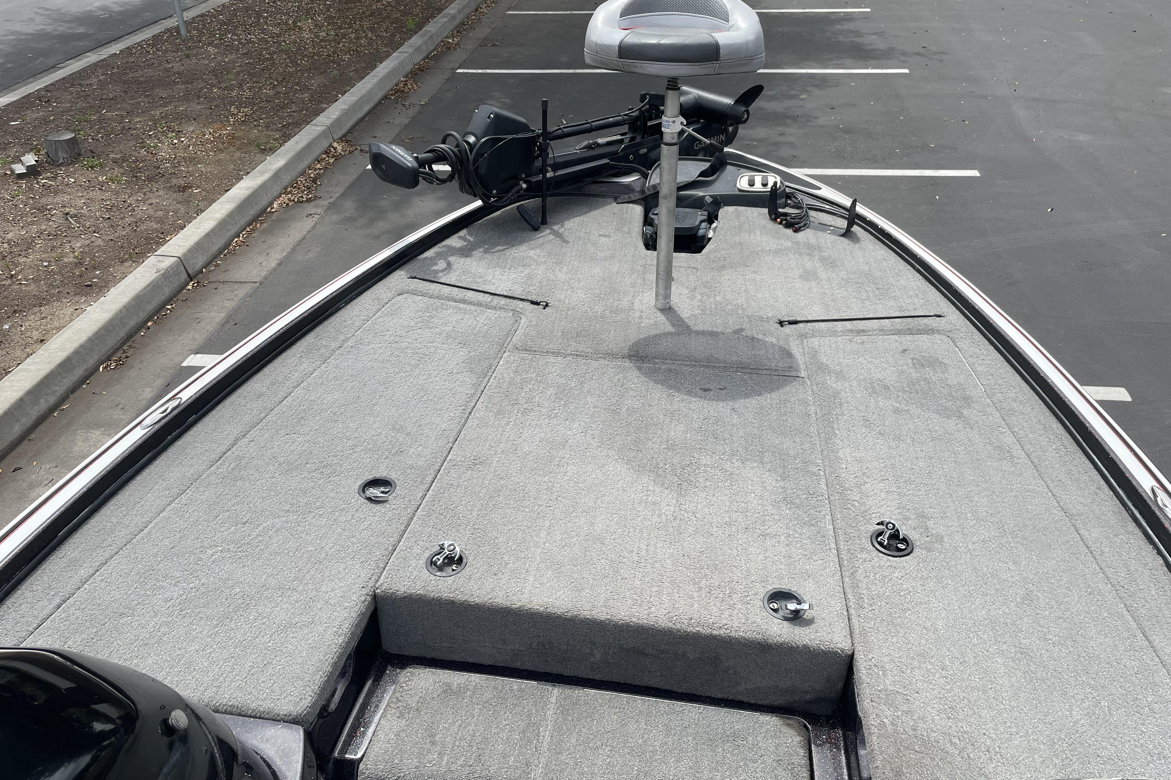Front deck of a 2013 Nitro Z-8 boat in a parking lot.