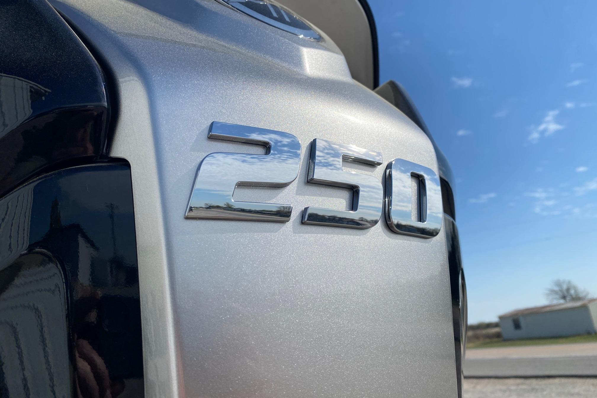 Close-up of SunCatcher Select 322RC 2026 model with '250' emblem under blue sky.