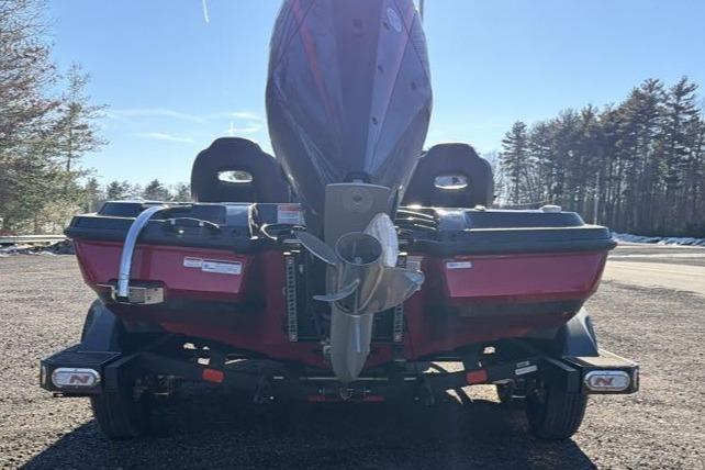 2026 Nitro Z21 XL Pro boat rear view with outboard motor in a sunny outdoor setting.