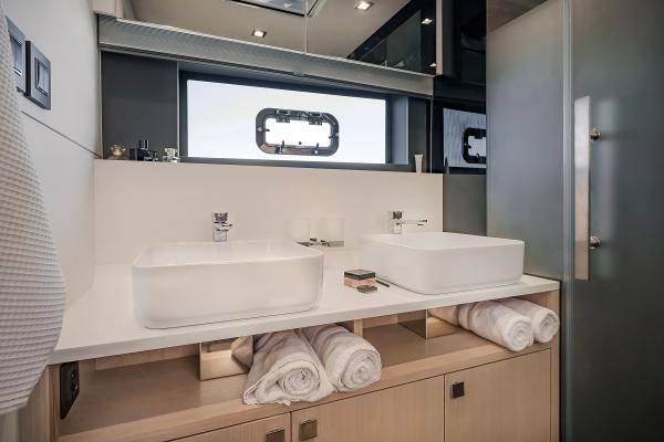 Luxurious bathroom in 2025 Privilege Signature 650 yacht with dual sinks and modern design.