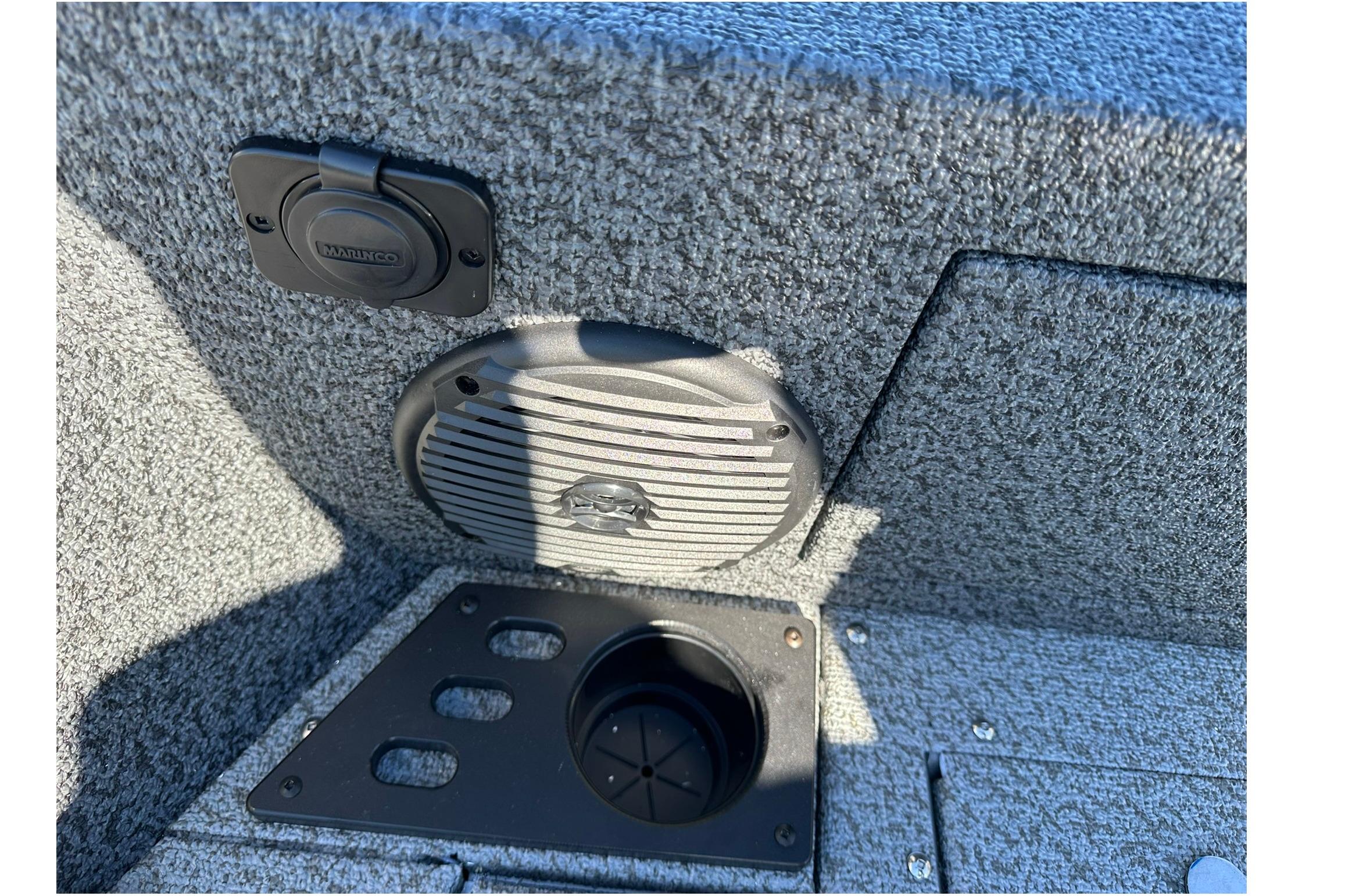 2026 Lund 1875 Impact XS Sport boat interior with speaker and cup holder.