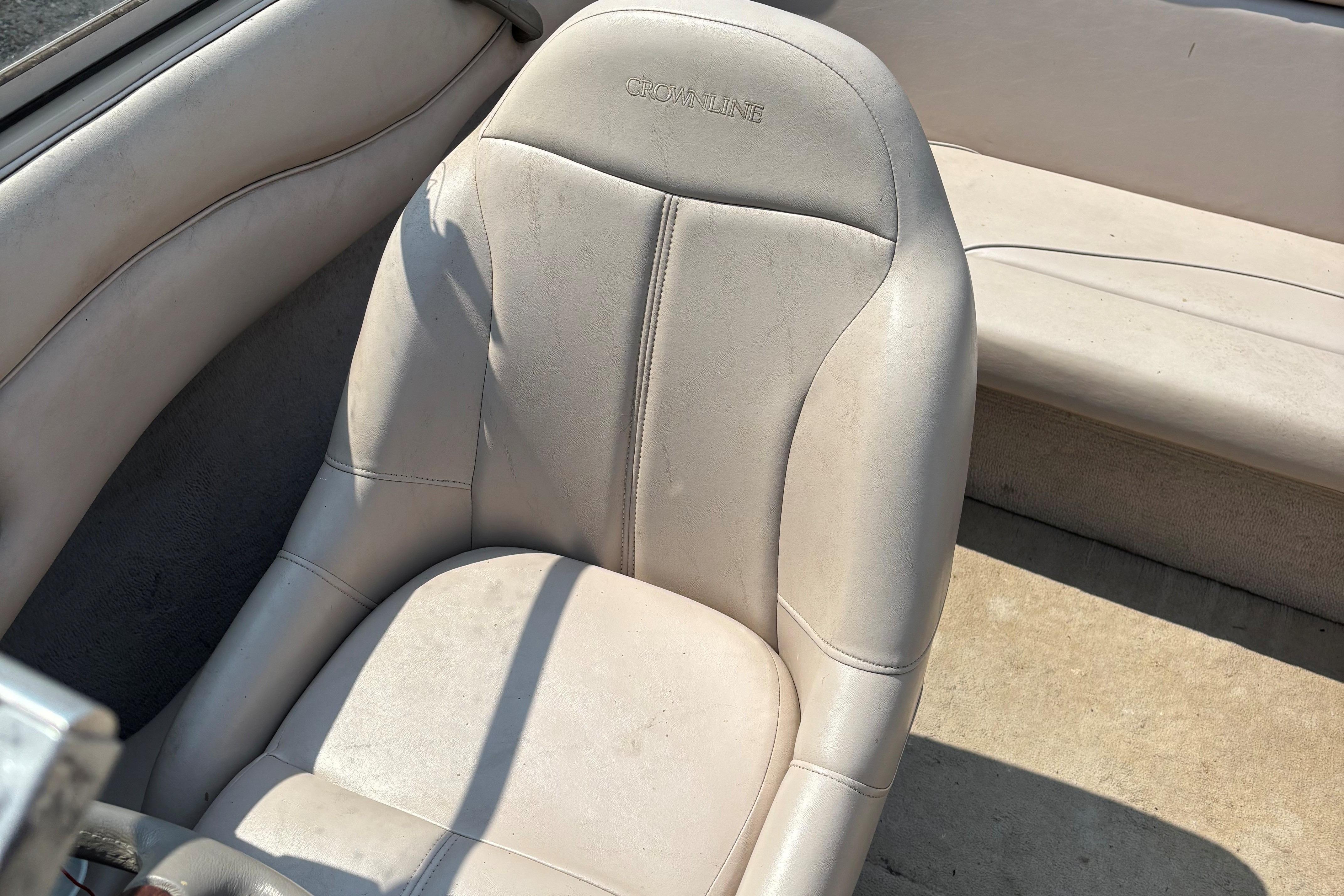 Crownline 18' 2001 boat interior with beige seating and upholstery.