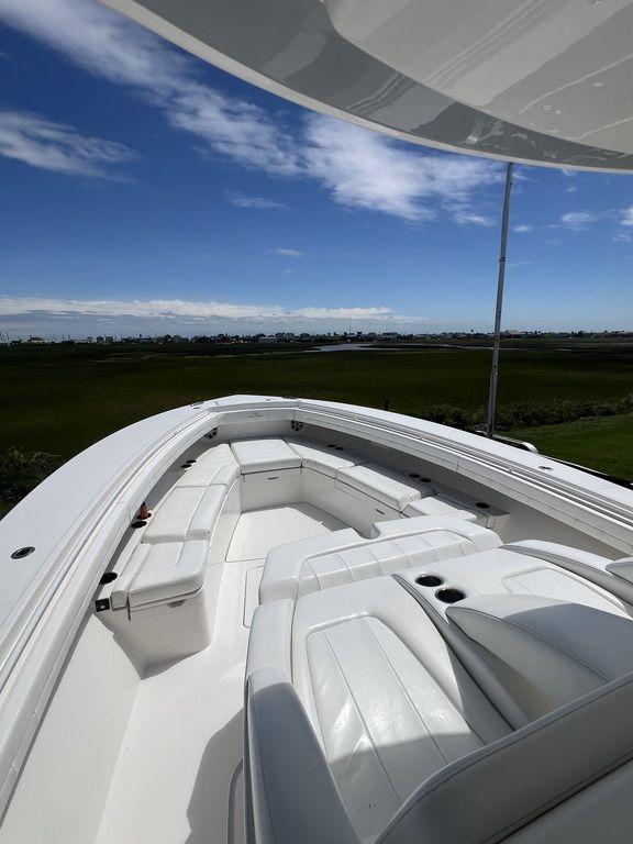 Luxurious 2021 Regulator 41 boat with spacious deck and seating area.