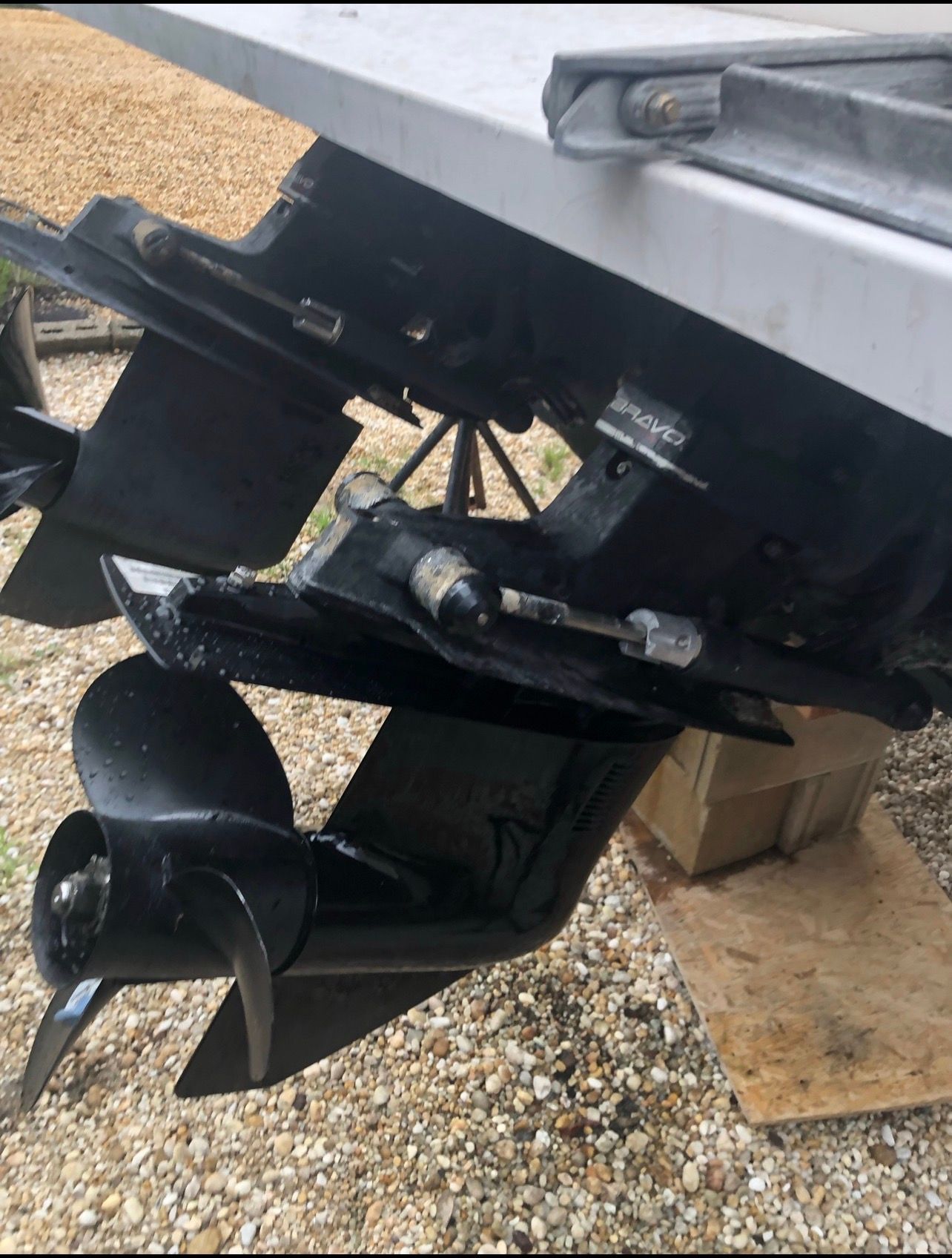Close-up of a boat propeller and motor on a trailer.