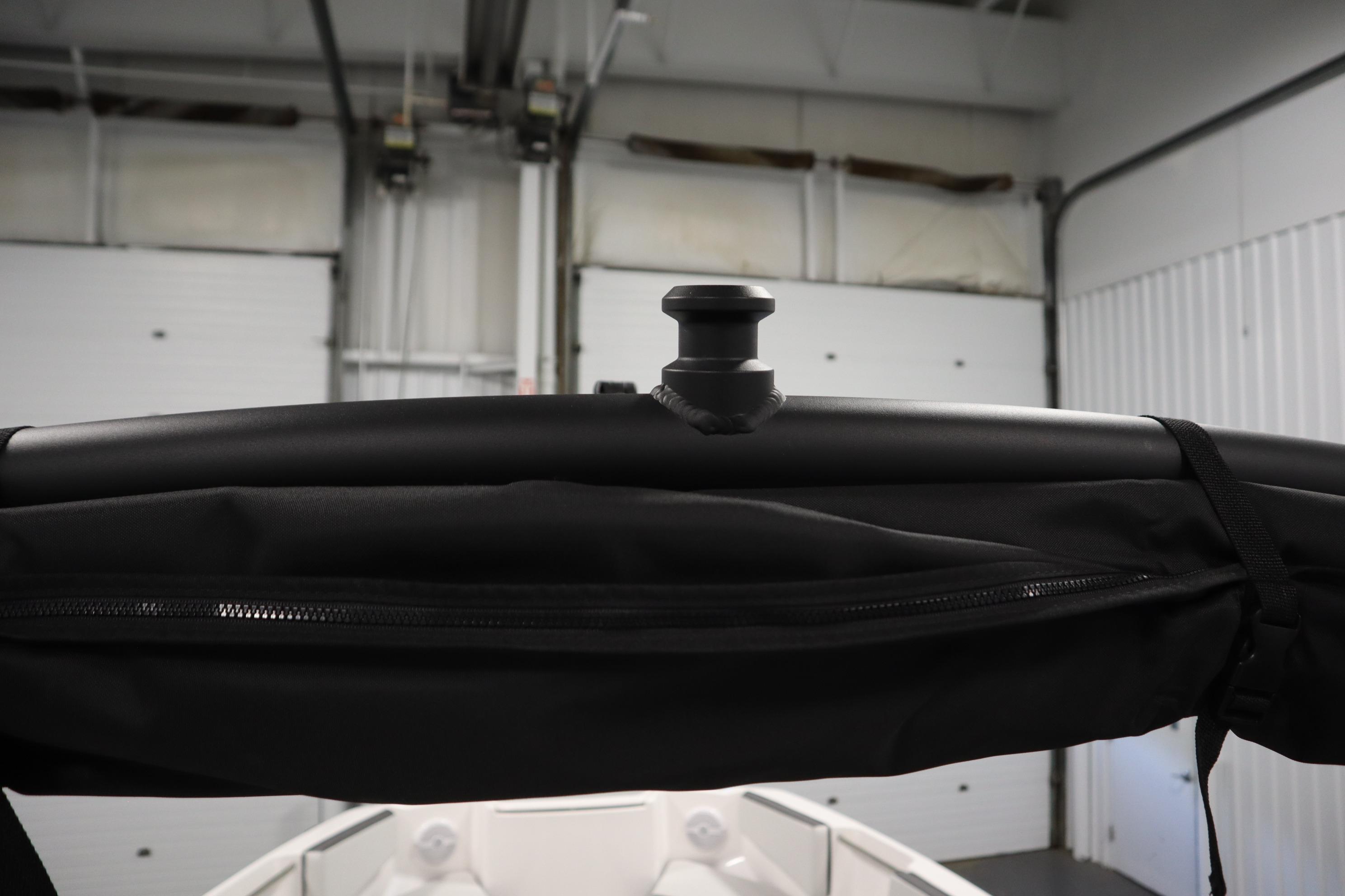 2026 Yamaha Boats AR220 interior detail with black canopy and support structure.