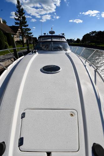 1997 Sunseeker Camargue 47 yacht deck under clear blue sky.