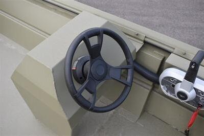 Steering wheel of 2025 Lowe Roughneck 1860 Rambler boat, showcasing control panel details.