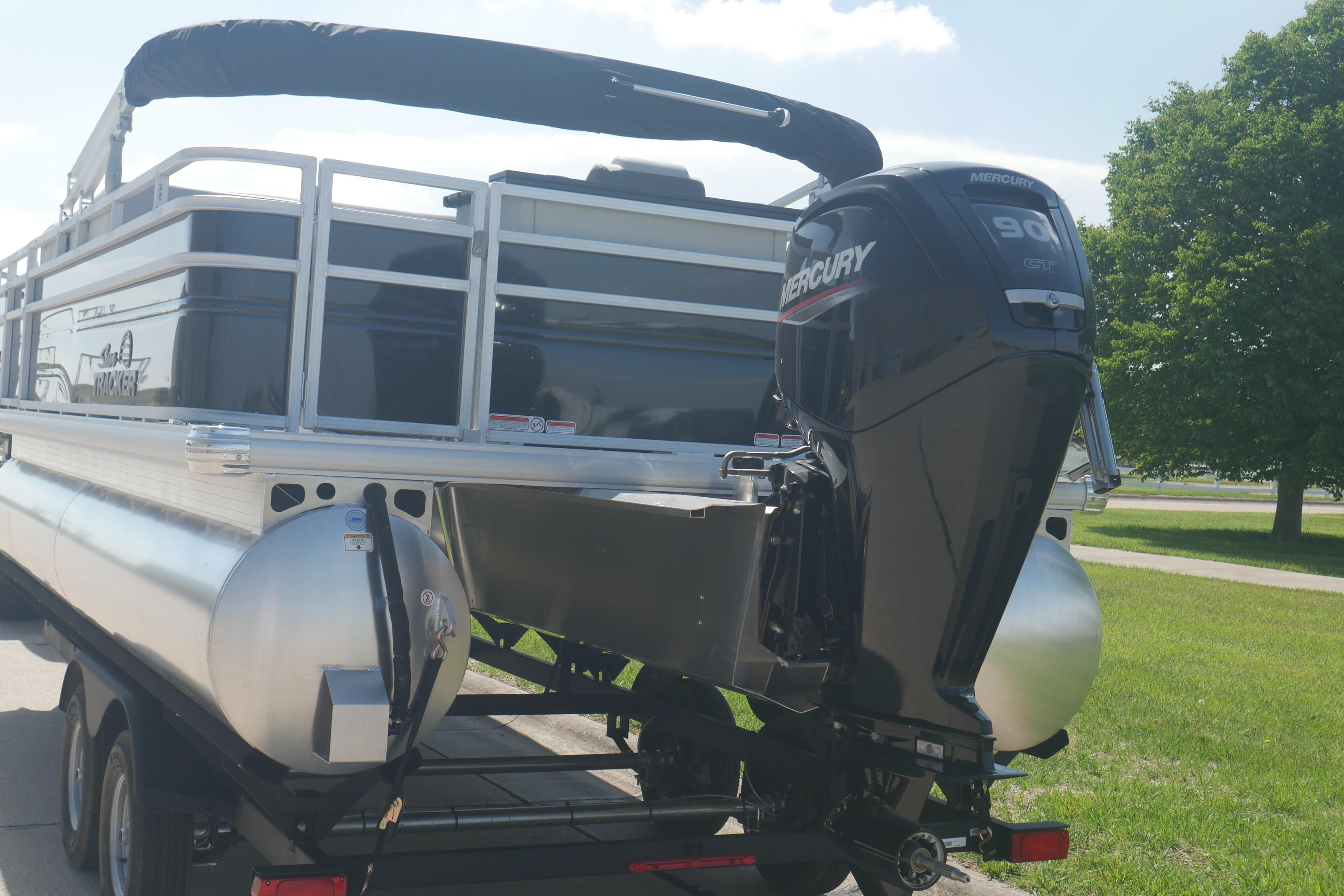 2026 Sun Tracker Fishin' Barge 20 DLX with Mercury 90 engine on trailer.