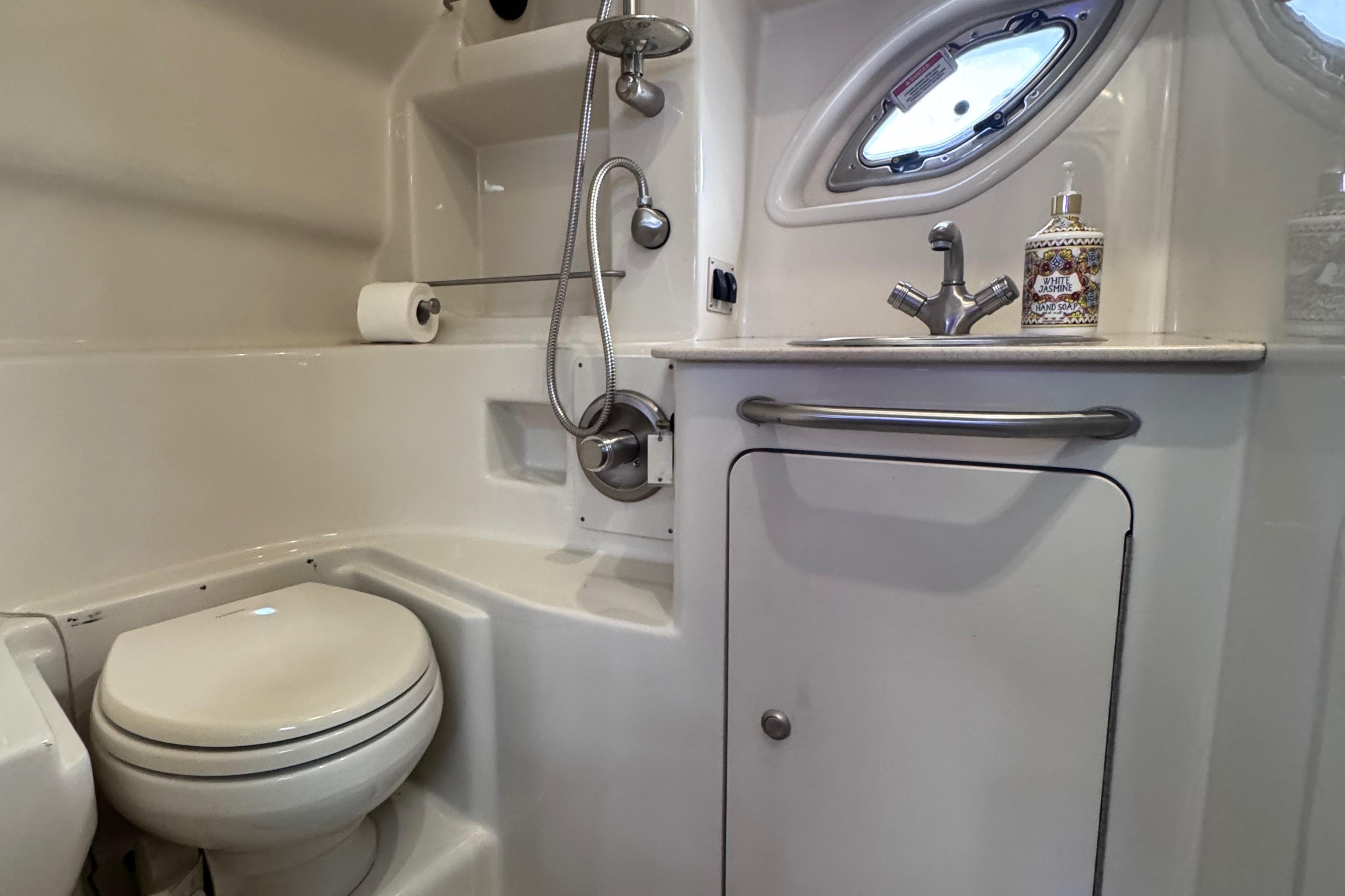 Luxurious bathroom in 2008 Sea Ray 350 Sundancer yacht with modern fixtures.