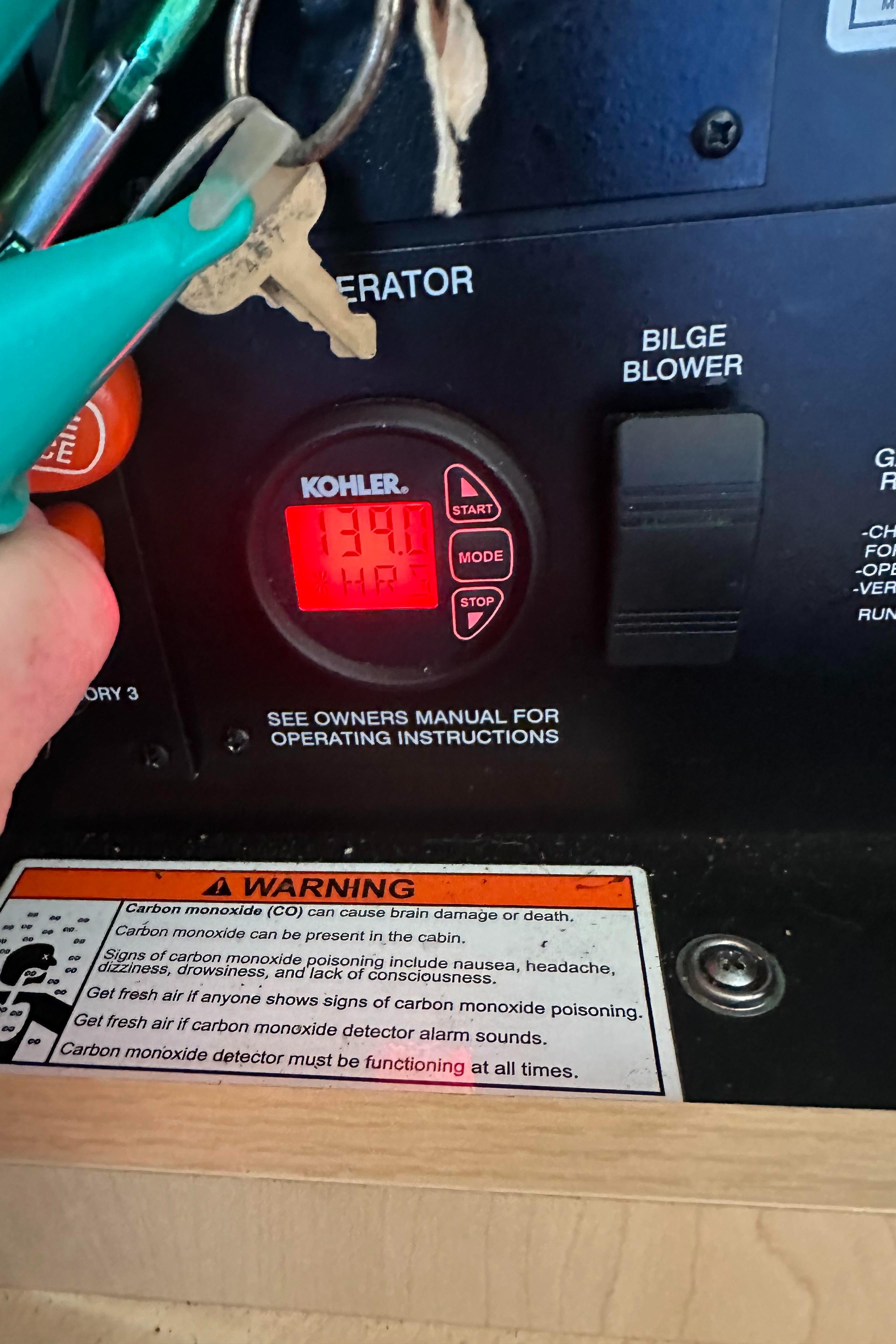 Control panel of a 2013 Sea Ray 370 Venture boat with Kohler generator display.