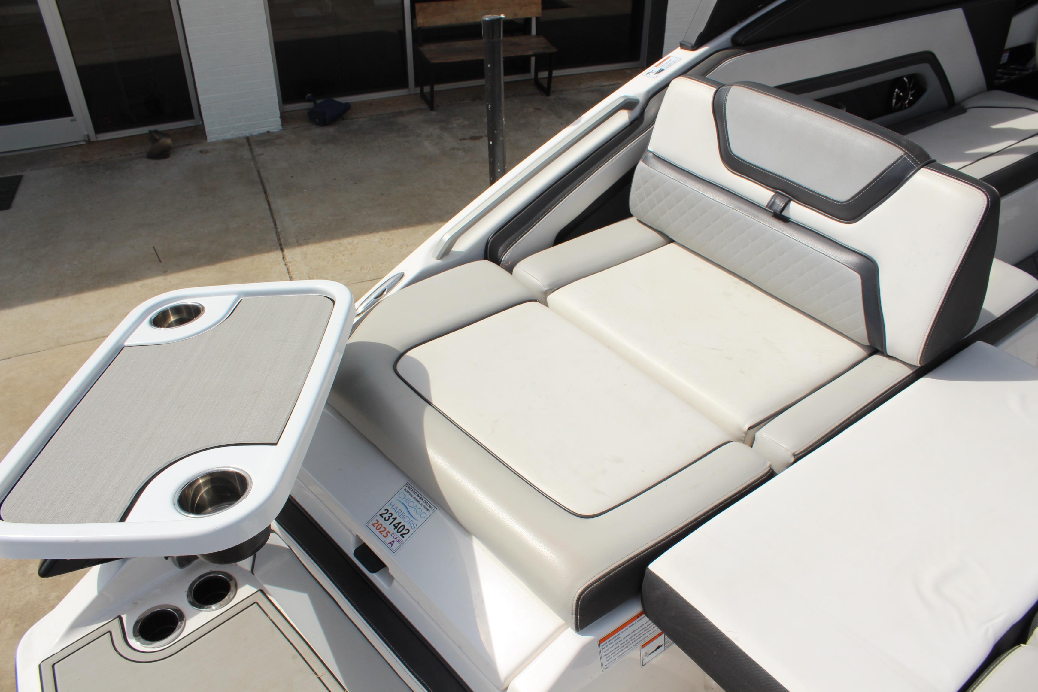 2020 Yamaha Boats 275SE interior with cushioned seating and built-in cup holders.