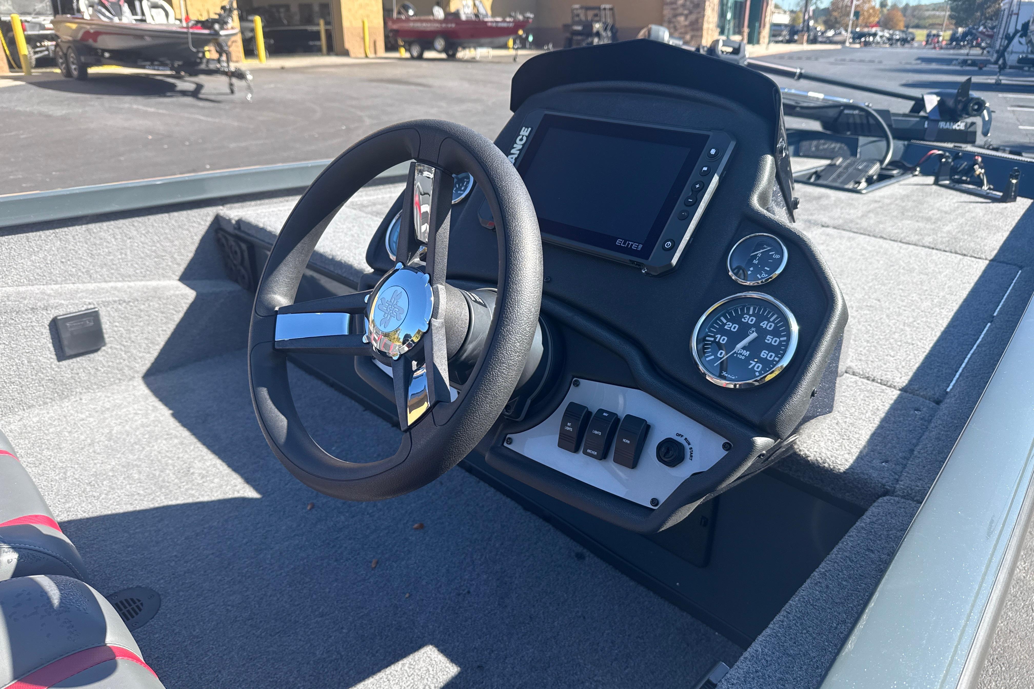 2025 Ranger RT188 boat dashboard with steering wheel and control panel.