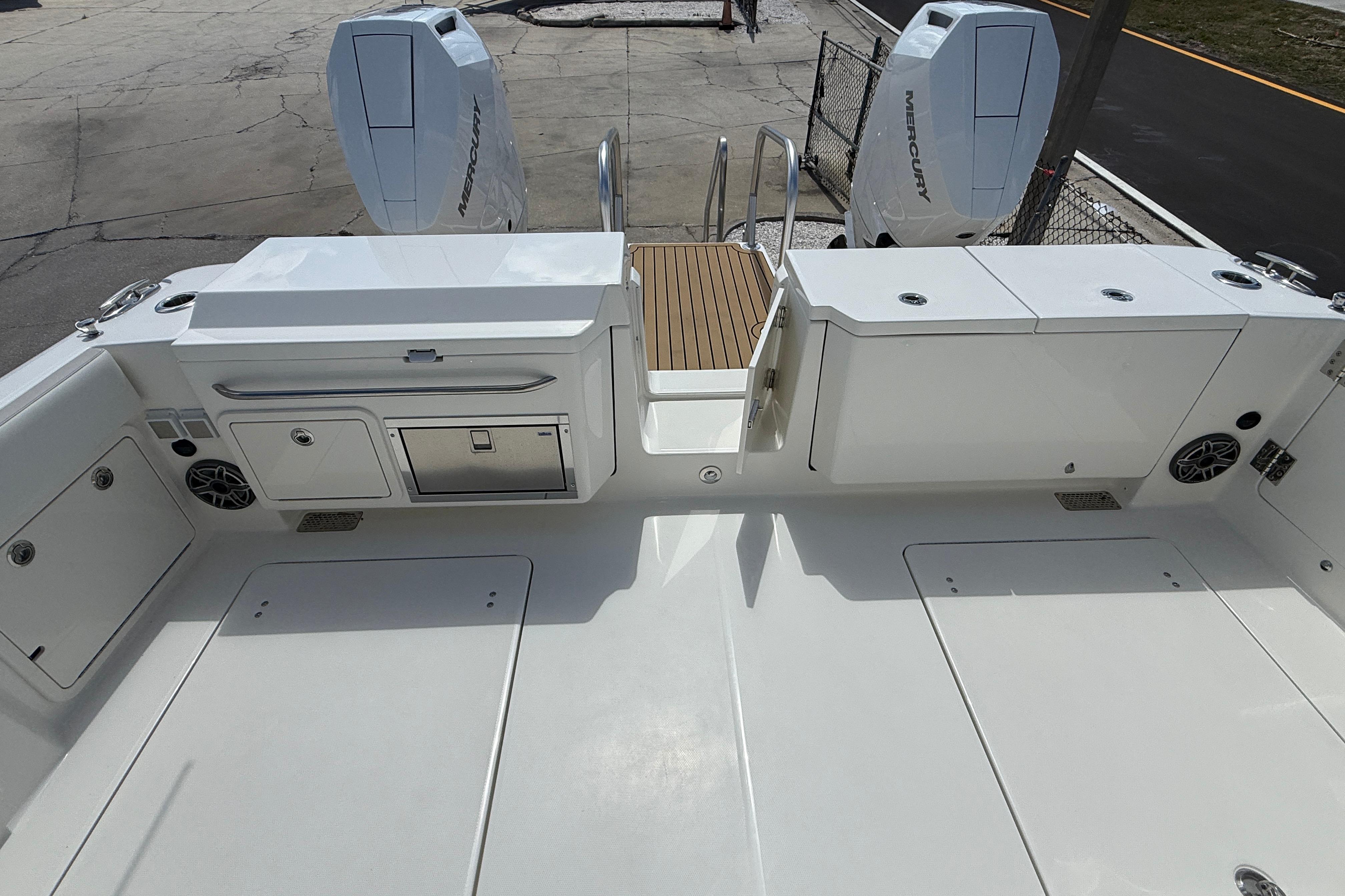 2026 World Cat 400 DC-X Island boat deck with twin Mercury engines.