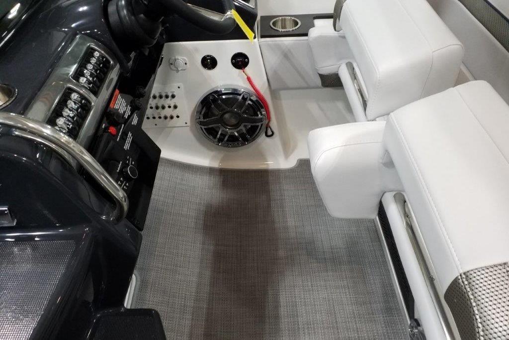Interior of 2021 Formula 350 Sun Sport boat with white seating and control panel.