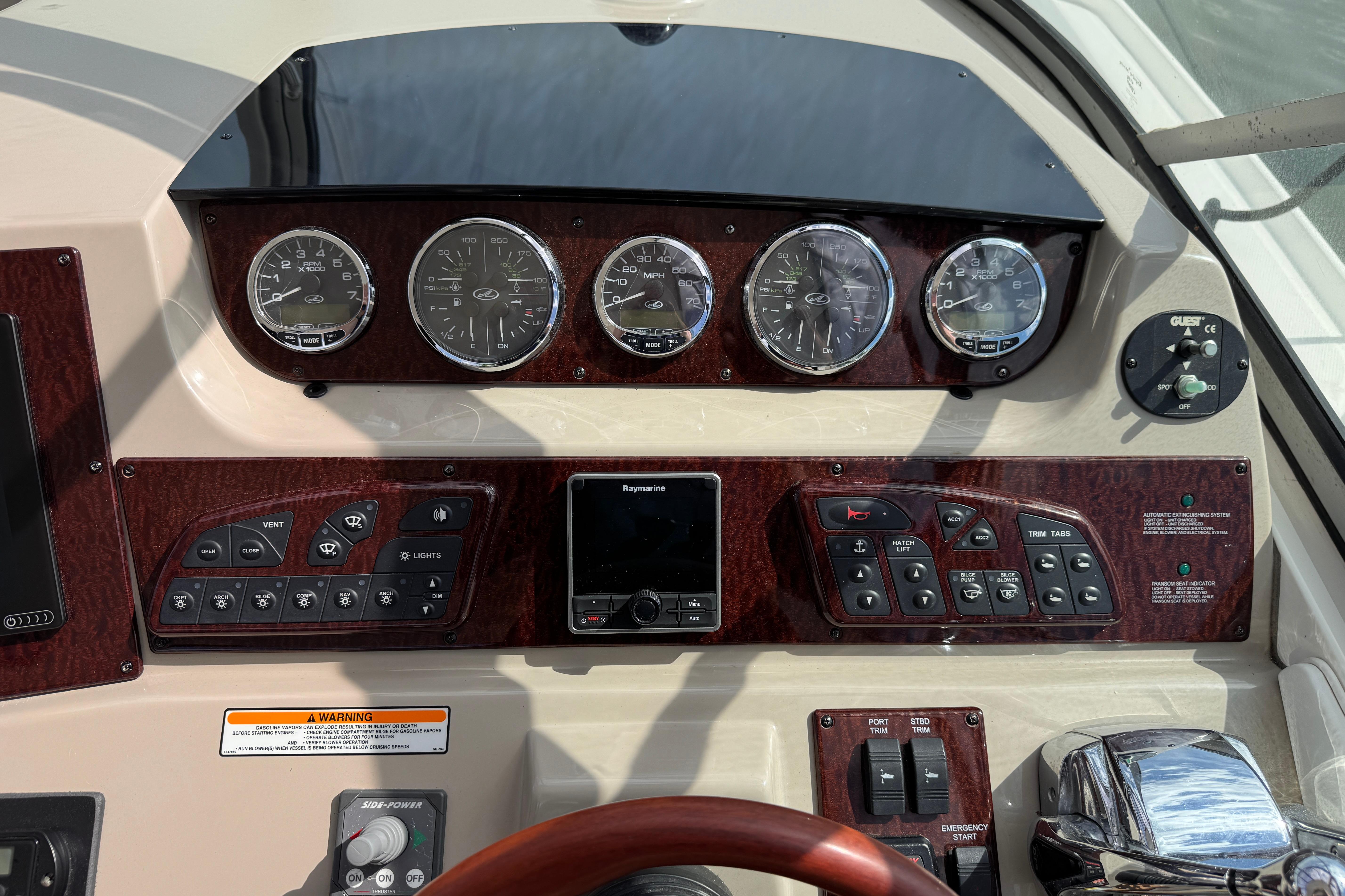 Dashboard of a 2008 Sea Ray Sundancer 350 with gauges and control panels.