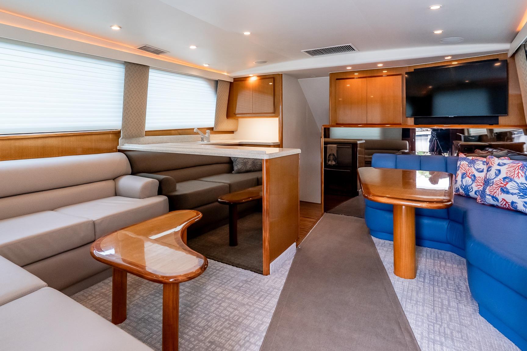 Luxurious interior of a 2000 Viking 50' Convertible yacht with modern furnishings and elegant design.