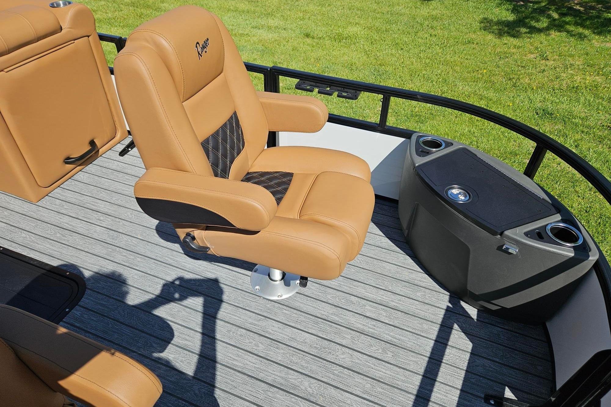 Luxurious seating on 2026 Ranger 223F boat with tan upholstery and modern design.