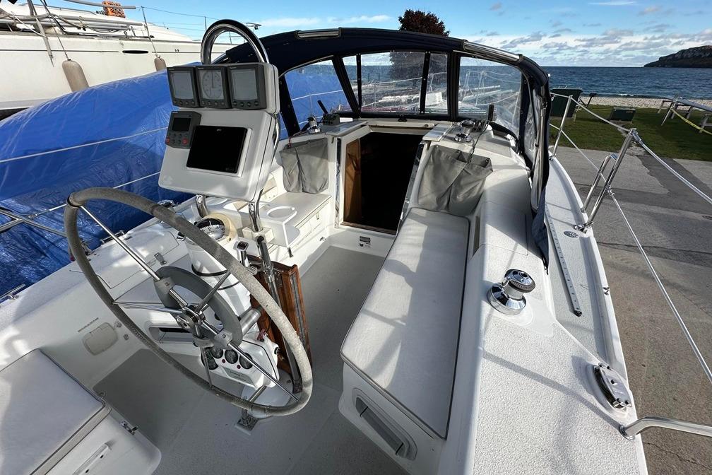 2005 Catalina 28 MkII sailboat cockpit with steering wheel and navigation equipment.