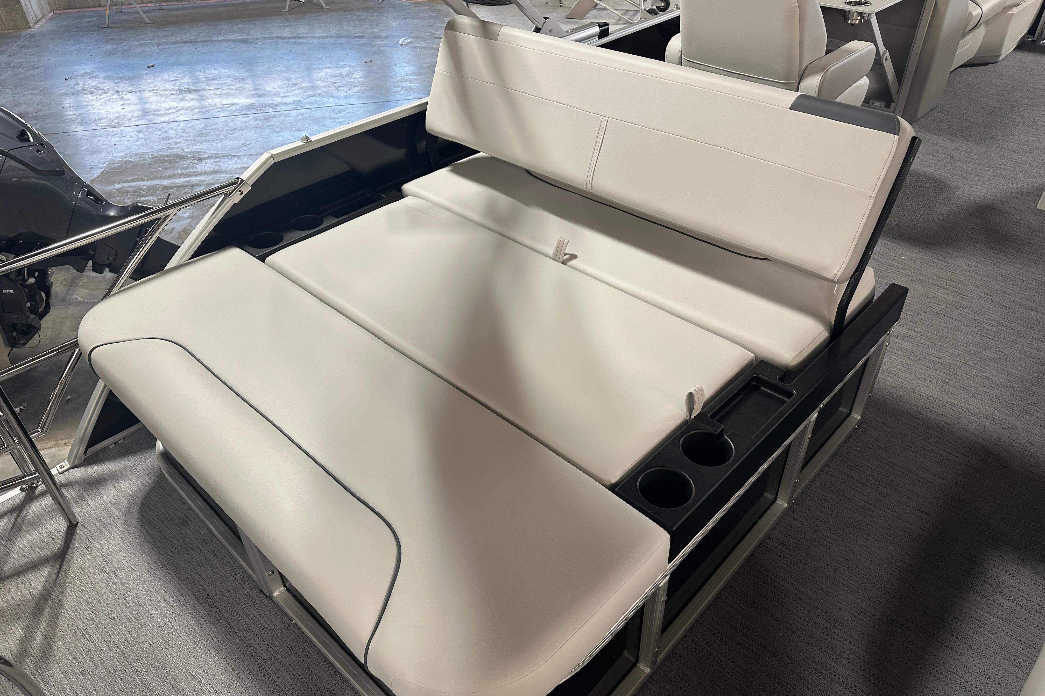 2026 Godfrey SW 2286 SFL boat interior with beige seating and cup holders.