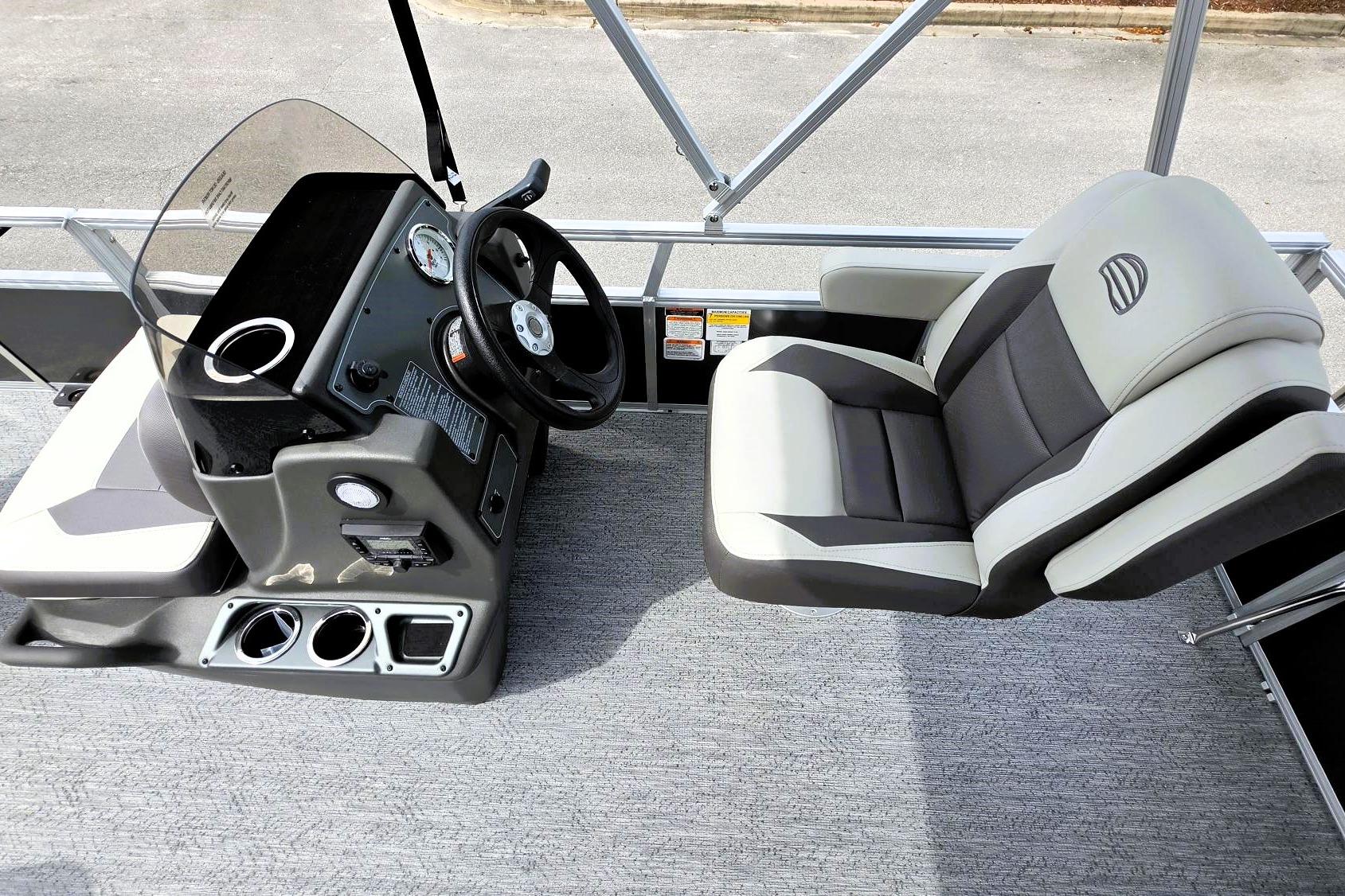 2026 Sun Tracker Bass Buggy 16 XL Select boat interior with steering console and seating.