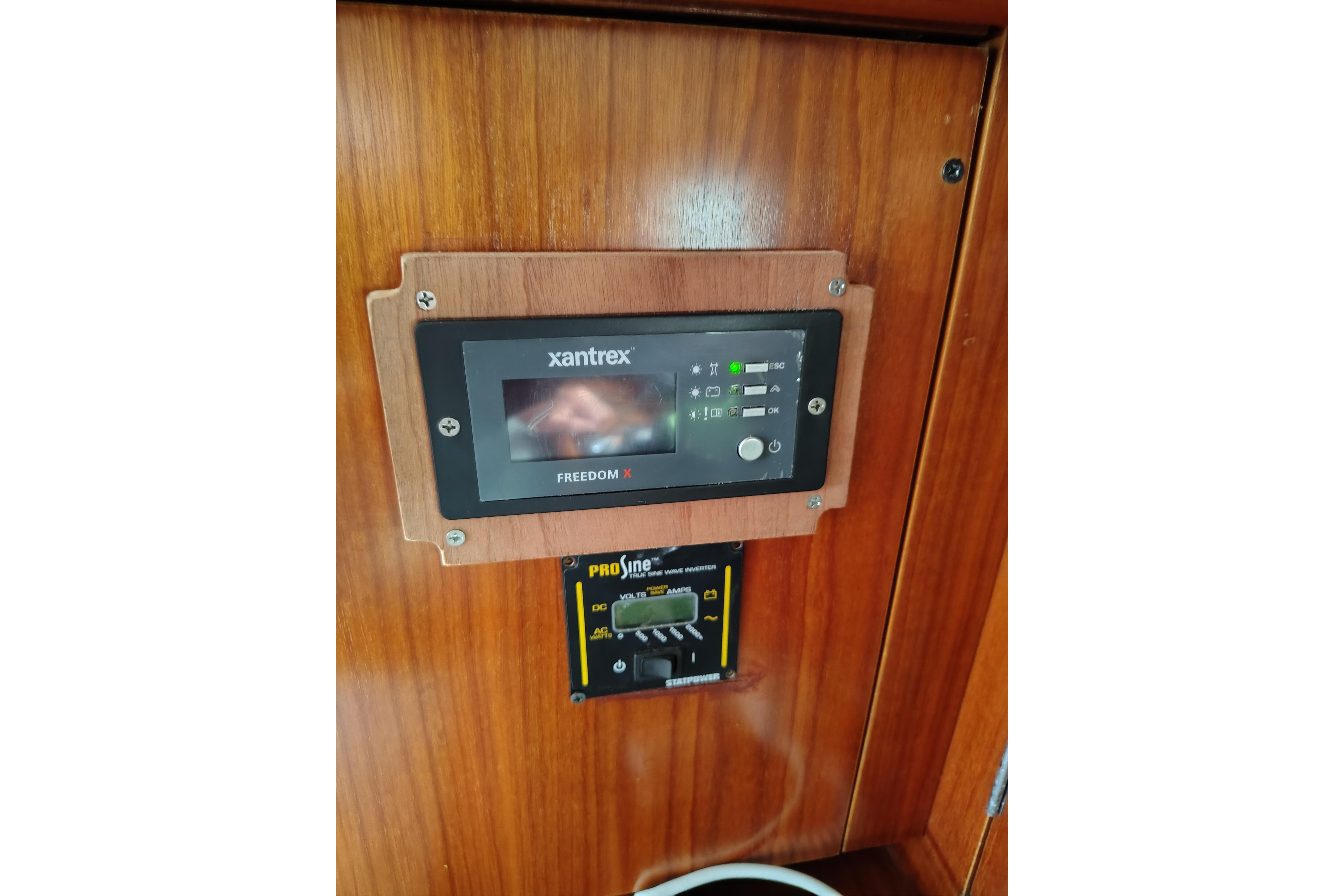 Control panel on 2001 Beneteau Oceanis 411 sailboat, featuring Xantrex Freedom X inverter.