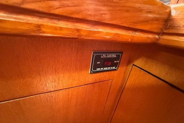 LPG control panel on 2005 Hunter 38 boat with wooden interior.