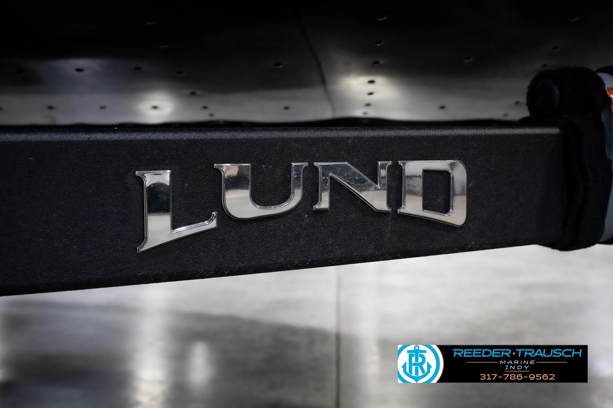 Chrome "Lund" logo on 2026 Lund 1875 Impact XS SS boat trailer.