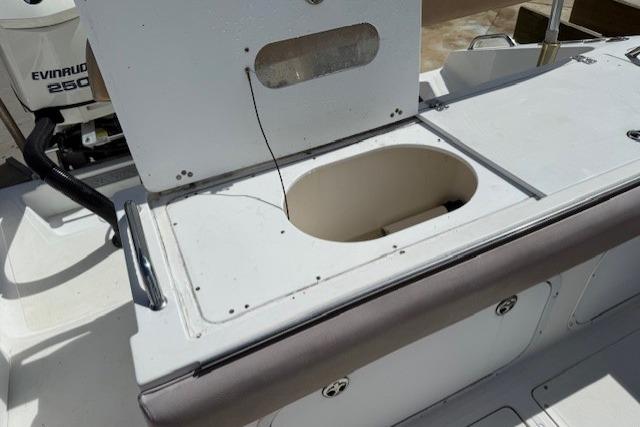 2005 Dakota 36 CC Forward Cuddy Cabin boat with open storage compartment.