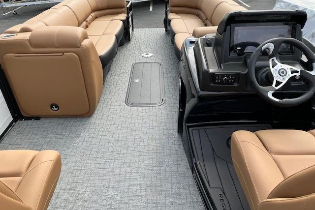 Luxurious 2026 Regency 250 DL pontoon boat interior with tan seating and modern helm.