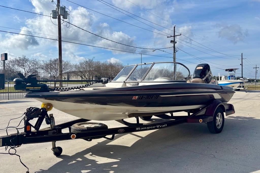 2008 Ranger 180 Reata boat on trailer under blue sky.