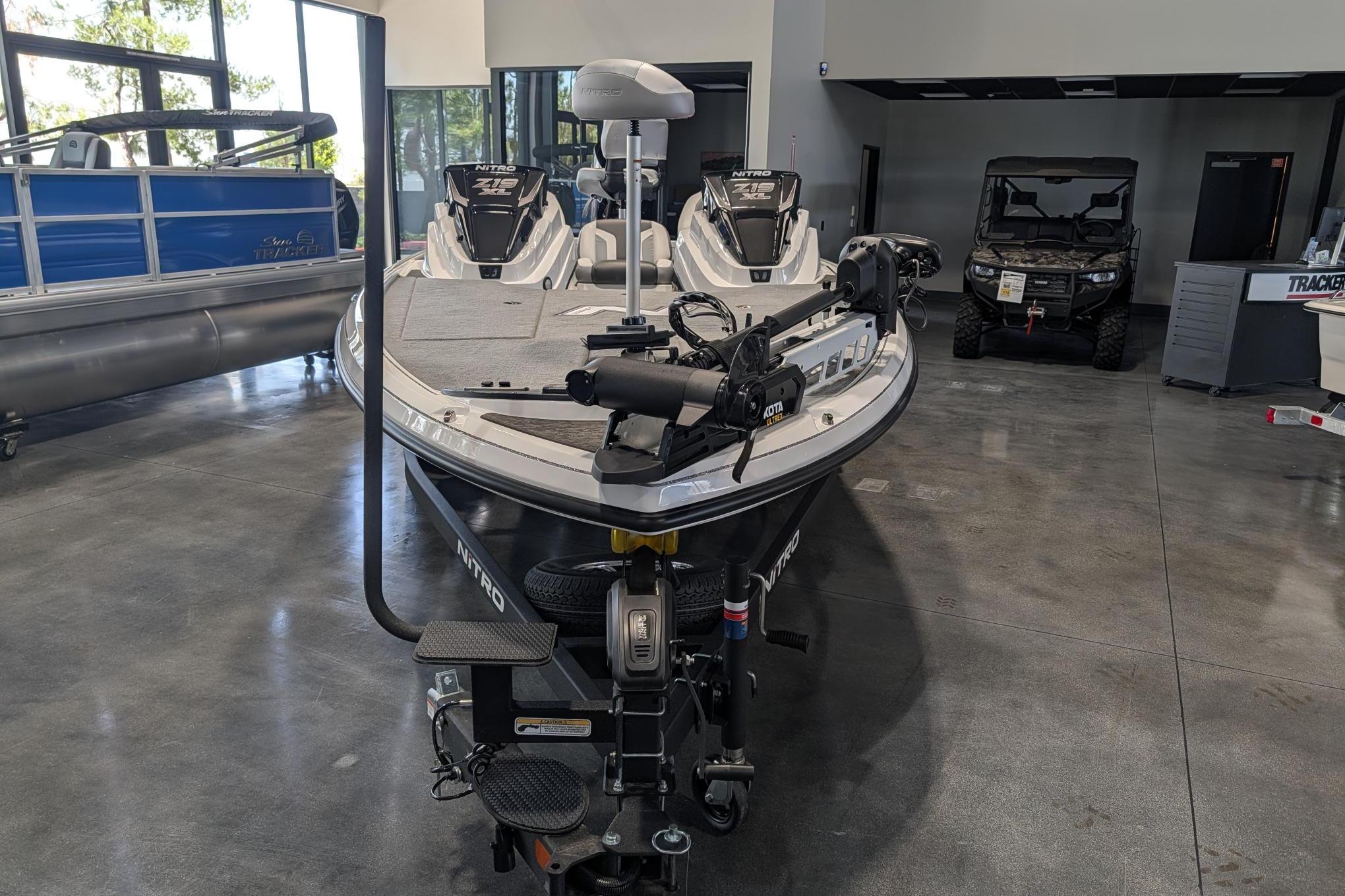 2026 Nitro Z19 XL Pro boat displayed in showroom, featuring advanced fishing equipment.