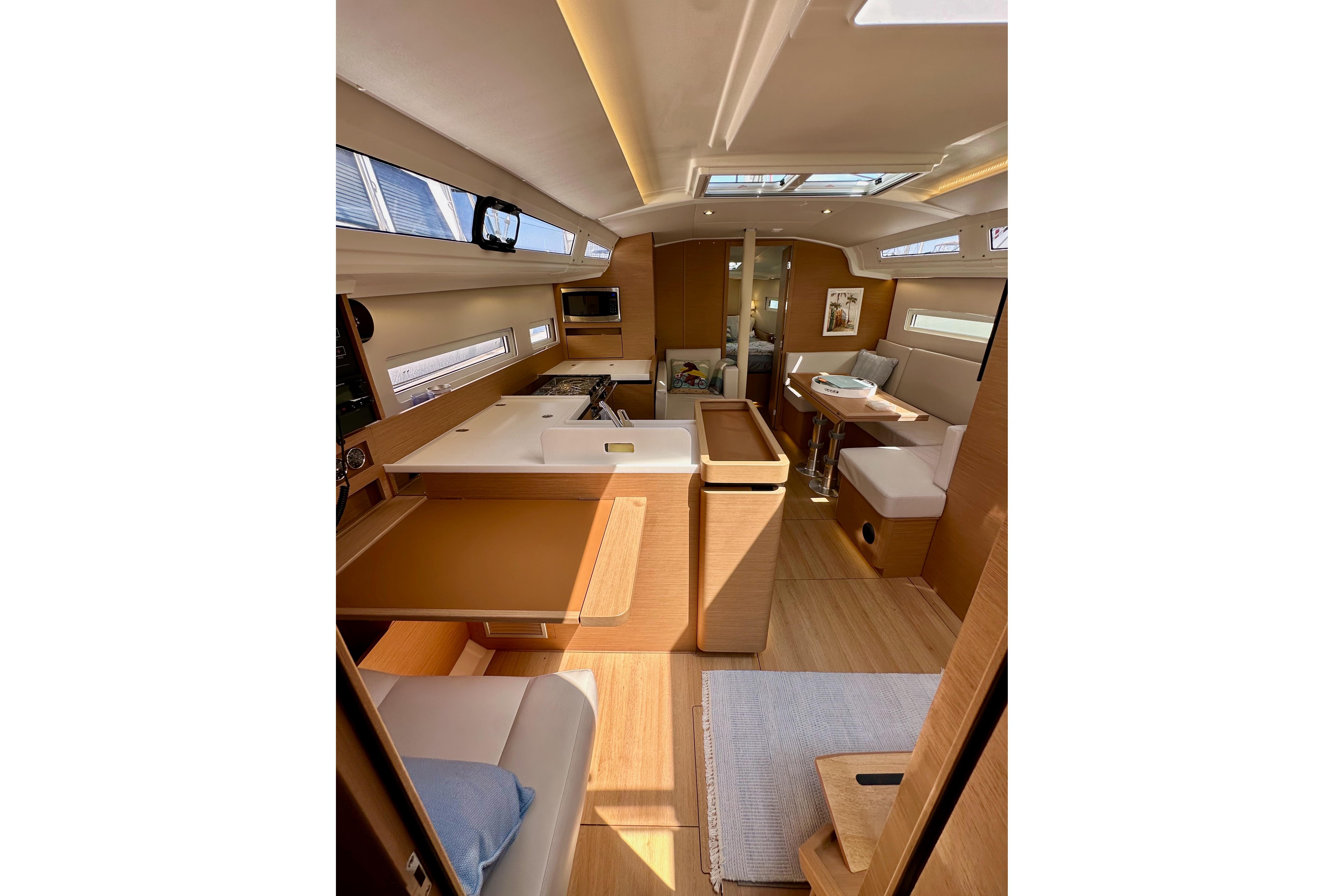 Interior of 2024 Jeanneau Sun Odyssey 410 yacht, featuring modern design and spacious layout.